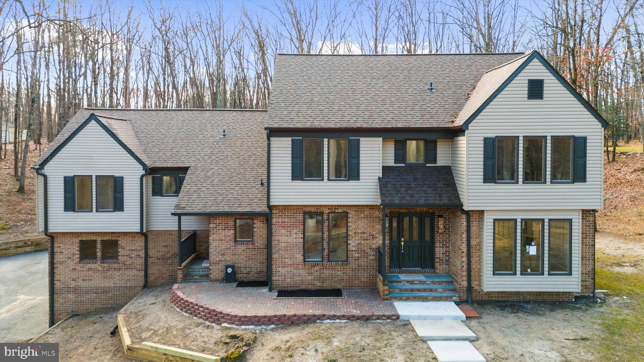 Welcome to 1439 Dicus Mill Road — a truly one-of-a-kind opportunity to start 2026 off right in a home that rarely comes along in this area: a fully renovated, move-in ready modern farmhouse-style colonial on a 2-acre, tree-lined lot, featuring 7 bedrooms, 4.5 bathrooms plus office, 3,545 sq ft above grade plus a  1,770 sq ft basement, and a large 2-car garage. Set back from the street overlooking Dicus Mill Road, the property offers a private, tucked-away feel.This is true turnkey with real peace of mind — not just new finishes, but major updates including updated roofing, plumbing, and electrical, plus three HVAC systems, updated well and septic, and propane installed for the chef’s range. The Stainless Steel chef’s kitchen is fully equipped with a 6 burner gas range with convection and air fry, a built-in microwave, low db dishwasher, large 4-door french door refrigerator, and wine cooler, along with quartz countertops and a farmhouse sink. Designed for comfort and entertaining, the home features two front entrances, a large rear deck, and two modern fireplaces (non-wood burning) — one in the main family room and one in the basement family room. The walkout basement adds incredible flexibility for recreation, guests, multigenerational living, or home gym space. The large primary master suite with walk-in closet, delivers spa-level comfort with a Euro-style double shower, soaking tub, double vanity, and a large linen closet. Even the essentials are done: brand-new washer and dryer are installed. Nothing left to do — just move in and enjoy.Move-in ready / turnkey + peace of mind2 acres, tree-lined, set back on a hill7BR / 4.5BA plus office3,545 SF above grade +  1,770 SF walkout basementLarge 2-car garageLarge rear deckTwo front entrancesTwo modern fireplaces (non-wood burning)3 HVAC systemsUpdated roof / plumbing / electricalUpdated well & septicBrand-new washer & dryer installedChef’s Stainless Steel kitchen: 6 burner gas range,  4-door french door fridge, Built-in Microwave, low db Dishwasher, Wine Cooler, farmhouse sink, and quartz countertops. Large Master Suite with Walk-in Closet, Large custom double shower, soaking tub, double vanity, and a large linen closet.