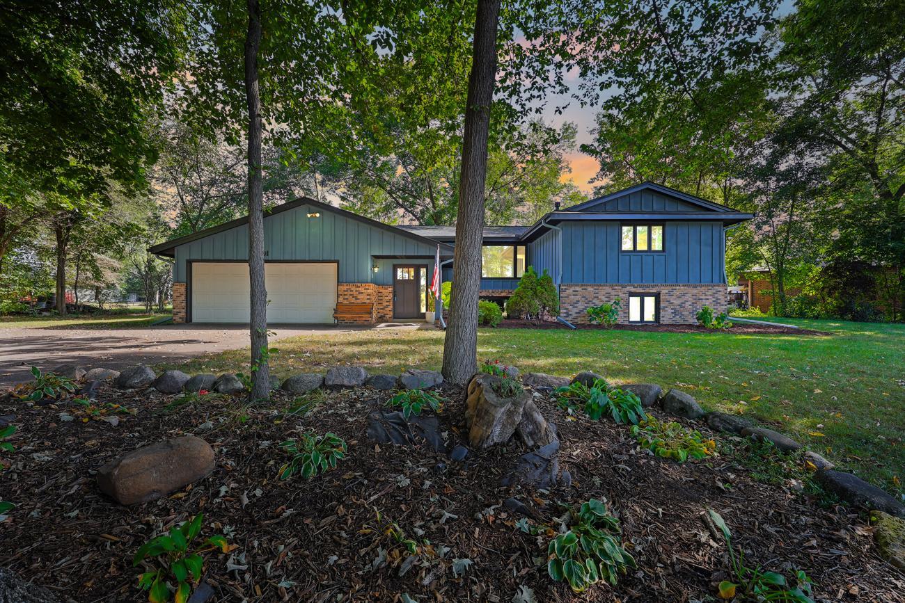 Come see this stunning home featuring extensive updates throughout! This spacious 5-bedroom property offers an oversized 4-car garage and a wooded lot conveniently located near parks and river trails.  Step inside to a large foyer with an oversized coat and boot closet. The beautifully updated kitchen features custom enameled soft-close cabinetry, stunning granite countertops, luxury vinyl plank flooring, and Samsung stainless steel appliances.  Throughout the home, you'll find fresh flooring and Sherwin-Williams eggshell paint, along with freshly installed bathroom vanities, Moen oil-rubbed bronze fixtures, and tile finishes. The five generously sized bedrooms offer plenty of flexibility for bedrooms, a home office, craft room, exercise space, or additional storage.  Major mechanical and exterior updates provide peace of mind, including furnace and A/C, laundry appliances, gutters, steel-wrapped exterior fascia, and a new roof installed in September 2024. The home also features an updated front door, rear service door, and French patio door, plus an asphalt driveway installed in 2022.  With abundant storage, extensive recent updates, a wooded setting, and an oversized 4-car garage, this home offers the space, comfort, and convenience you've been looking for. Come see everything this exceptional home has to offer!