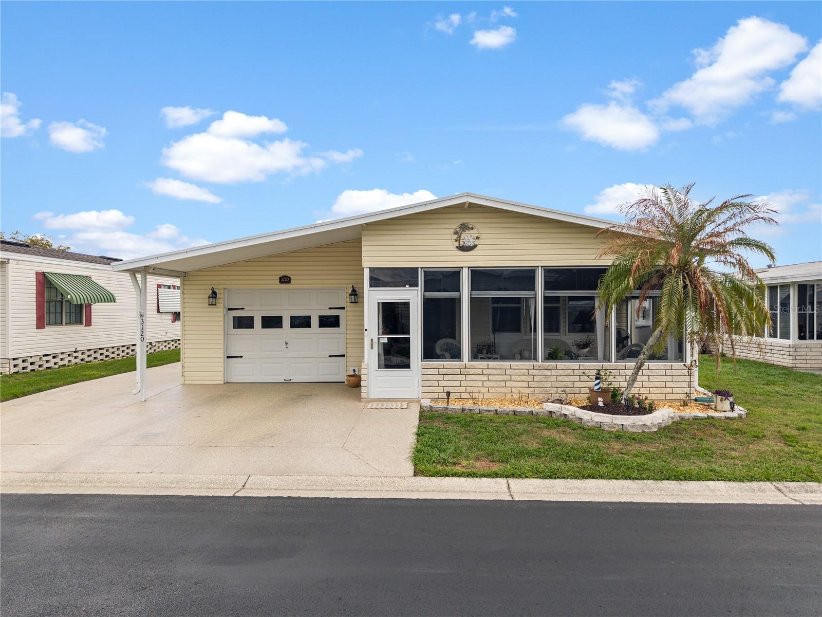 Welcome to Timber Lake Estates! An all aged community! This Beautiful split floor plan updated home with garage is waiting for you. Some of the features include an updated Kitchen with quartz counter top's, Recessed lighting and large stainless steel farm sink. Master Bathroom was remodeled with an oversized shower with seat, Glass Doors and rainfall Shower Head, Updated Cabinetry with quartz counter tops. The Guest Bath was remolded as well. Luxury Vinyl flooring though out except in the master bedroom. Windows are updated as well Except for guest Bath and garage. A front and rear Lanai with sliding windows will help you relax. This home is in a great location with easy access to Wesley Chapel and Zephyrhills. All this and located in a very desirable all aged well kept family oriented community with tons of activities and great amenities some of which include 2 pools, 2 clubhouses, Shuffleboard and Basketball courts, fishing lake with dock and YOU OWN THE LAND.