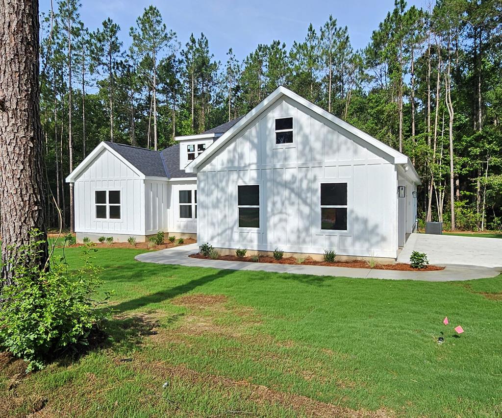 New construction homes featuring custom finishes in a great Cairo, Georgia subdivision. Conveniently located near Thomasville, Bainbridge, and Tallahassee. Three homes sit on 3-acre tracks, with two additional homes on a 1.5-acre tract. Covered patios and thoughtfully designed layouts offer modern living with plenty of space. Primary  bathroom includes a large tile shower and double vanities. Luxury Vinyl Plank (LVP) flooring runs throughout the home for durability and style. The kitchen showcases an abundance of cabinets, a kitchen bar, and granite countertops. Outdoor spaces include covered patios for comfortable outdoor living.
