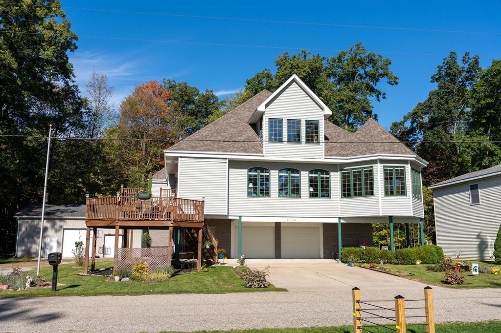 First time offered for sale. Dont miss this opportunity to own a one-of-a-kind 4+ bedroom, 3-bath home with over 3,000 square feet of living space on beautiful Eight Point Lake. Includes 25x111 of private lake access to design your dream gazebo, outdoor kitchen, or entertaining space. Enjoy off-water taxes while still capturing spectacular lake views! This unique build includes a ground-level, 31x42 two car garage with room for vehicles, storage, and toys, plus mechanical room. A recently installed Generac 24k whole-house generator ensures peace of mind. From the garage, access the home by elevator or take the stairs up freshly stained multi-level decks to the main entry. The main level features a nearly 400 sq ft primary suite, complete with French doors leading into a 300 sq. ft. polygonal bay room where youll enjoy breathtaking sunrises and water views. The kitchen and dining areas feature cathedral ceilings, a large island with additional seating for five, and access to the large lake facing deck. The living room includes a natural gas fireplace for winter evenings, and french door access to the bay room. Two additional bedrooms, one with direct access to the back deck, along with a second full bath and large laundry room complete this level. Upstairs offers more cathedral ceilings with space to relax and entertain: an additional bedroom, full bath, wet bar, game room, family room, generous storage areas, and more breathtaking water views. The large lot provides expansive green space along with a 42x32 pole barn featuring 13 ft sidewalls, concrete approach and floors, 8x8 and 10x10 overhead doors, two service doors, and 100-amp panel. Eight Point Lake is known for excellent fishing, water recreation, sandbar gatherings, golf cart rides, summer concerts, and holiday events, including the July 4th 5k and Labor Day fireworks. Whether for seasonal use or year-round living, this home offers a great opportunity to enjoy all that lake living has to offer.