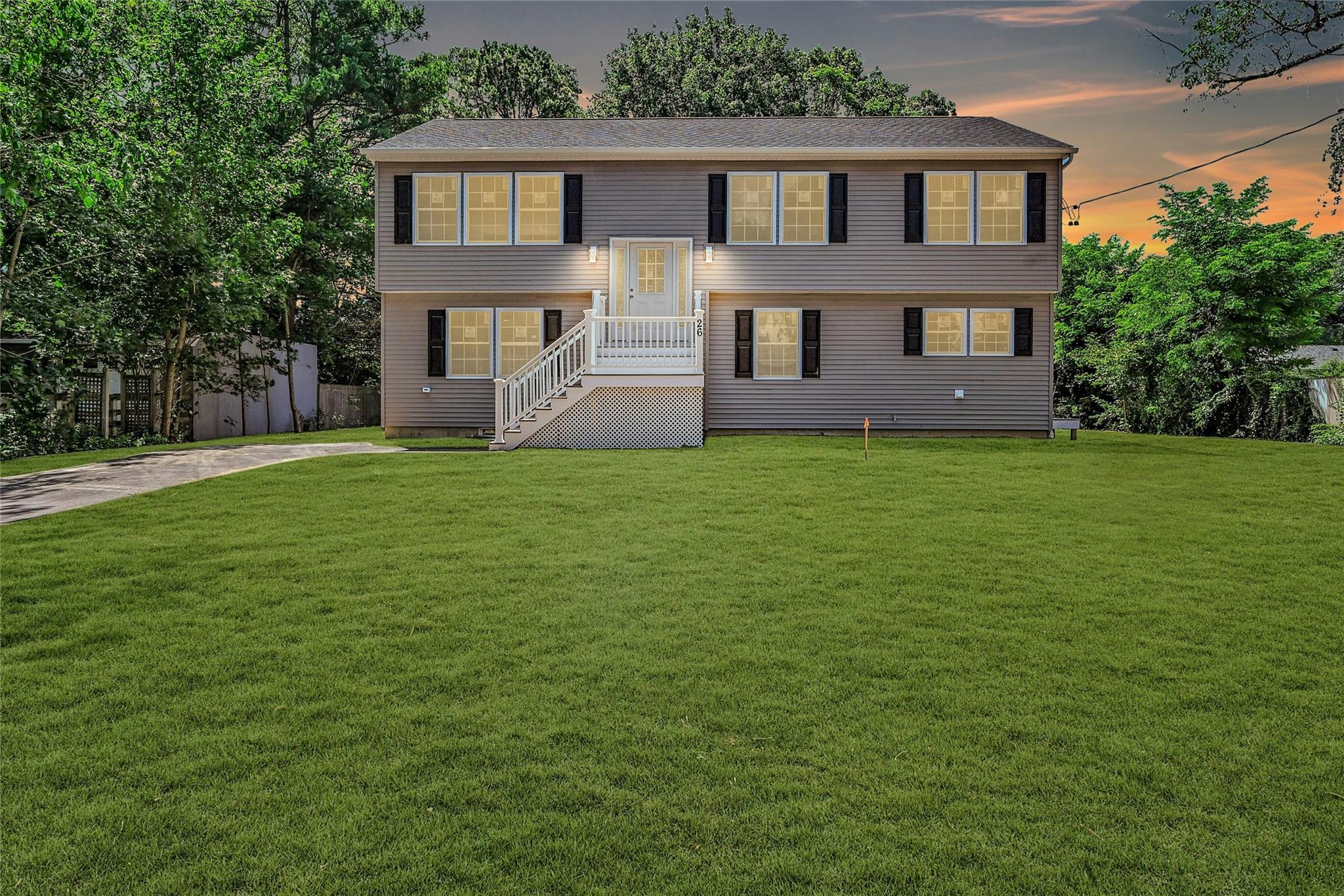 Welcome to 26 Coventry Avenue, Mastic, NY

Be the first to live in this stunning 2025 New Construction High Ranch offering a spacious layout with 4 bedrooms and 3 full designer bathrooms. Featuring gleaming hardwood floors throughout, this home is equipped with two-zone central air and forced hot air heat for year-round comfort.

The lower level includes a large bedroom and a great room (formal living room, and a home office)—perfect for flexible living and entertaining. The stylish laundry/mudroom with side entrance adds convenience to daily life.

The kitchen showcases elegant crown molding, white cabinetry, stainless steel Whirlpool appliances—including dishwasher, microwave, electric stove, and refrigerator—and a center island that anchors the space beautifully.

First Floor, you’ll find soaring ceilings, 3 additional bedrooms, a dining area, a den, and sliders that open to a private second-story deck with PVC railings—ideal for relaxing or entertaining.

All 3 bathrooms are finished with designer tile work and backlit vanity mirrors, with two offering bathtubs perfect for soaking and unwinding. High-hat lighting is featured throughout the home.

The home also boasts a full unfinished basement with high ceilings and an egress window, offering endless potential for future living space. A large private driveway completes this exceptional property.