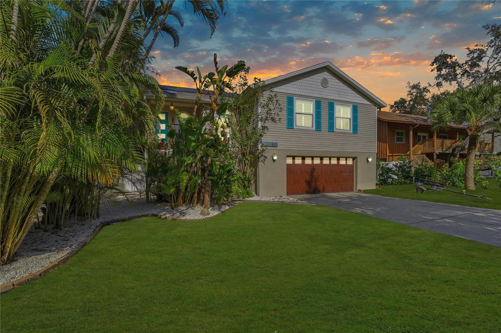 One or more photo(s) has been virtually staged. Welcome to Ozona living, where laid-back coastal charm meets a home packed with character, updates and room to enjoy every day Florida Living! This 3 bedroom, 2 bath single family home offers the kind of space and freedom that’s hard to find, especially with NO HOA! Bring the boat, the jet skis, or any of your toys and use the side parking pad or the backyard and skip the marina fees!Inside, an open floor plan makes everything feel bright and connected. The Spanish tile flooring ties the main level together with a warm, timeless look. The new kitchen steals the show with quartz countertops, pull out drawers, stainless steel appliances, a walk in pantry and a large island that makes the perfect gathering spot.You’ll appreciate upgrades throughout the home, including All New Hurricane Impact Windows, Doors and Garage Door (2022), New Roof (2019), paid off solar panels (2019) and a brand-new water heater (2024). This home is solid, efficient and ready for Florida weather!Downstairs opens up a whole new world of usable space. The bonus room and great room feature new Duramax water resistant walls, sleek epoxy flooring, a shiplap ceiling, a kitchenette and a full bathroom. This square footage and living space is not part of Public Records, but it's a flexible setup that works for entertaining, media room, hobbies, movie nights ~ The options are endless and it could even make for a great mother-in-law suite!The backyard is where this property really shines! An inviting saltwater pool with a PebbleTec finish (2020) is surrounded by gorgeous landscaping and plenty of space to unwind. A brick fireplace, covered bar and outdoor shower make this yard feel like a private getaway. The layout still leaves room to store water toys or golf carts and the French drain system keeps everything flowing smoothly out to the street.Life in Ozona is something special! This Coastal Golf Cart Community has a relaxed atmosphere, friendly streets and beautiful natural surroundings. The 47 Mile Pinellas Trail is just moments away for biking, running or cruising to nearby towns. Ozona’s restaurants, shops, taverns and live music are all within walking or golf cart distance and Downtown Palm Harbor is just around the corner.Right across the street, you’ll find local parks, ballfields, a skate park ~ Perfect for enjoying the outdoors. Several popular marinas are also nearby, including Home Port Marina, Island Harbor Marina and Ozona Fish Camp, making life on the water easy and convenient. You’re also a quick ride to Downtown Dunedin and the famous Sponge Docks in Tarpon Springs and even have golf courses like Innisbrook and Tarpon Springs Golf Course close by.This home brings together comfort, updates, outdoor living and Ozona Charm in a way that’s rare to find and easy to love!