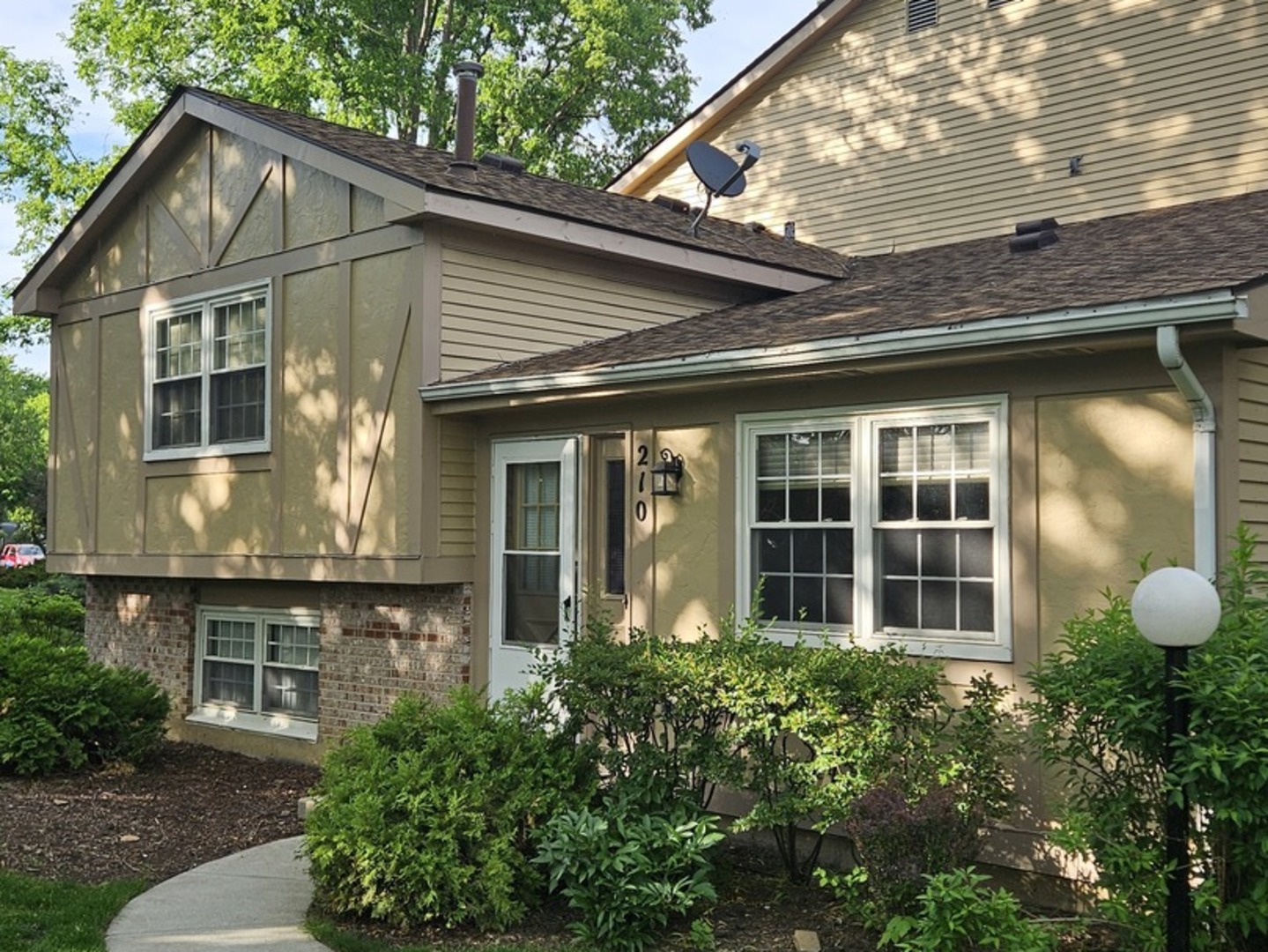Recently renovated 3-bedroom tri-level townhome in the Westwood subdivision - move-in ready, vacant, with immediate possession available. No dogs allowed in this Association, but some exceptions might applies, cats are allowed. The home backs to open green space with a private view of the greenery. Layout offers 2 bedrooms on the second floor plus a third bedroom and half bath on the lower level, 1.5 baths total, and an attached 1-car garage. Recent updates throughout: brand-new engineered hardwood flooring on the main and upper levels, brand-new vinyl plank flooring on the lower level, brand-new extended kitchen cabinetry with quartz countertops, ceramic tile in the kitchen, newer stainless appliances, new vanities in both baths, new light fixtures and recessed lighting in the bedrooms, new washer/dryer, new water heater, and fresh paint on all walls and doors. Lower level includes laundry and crawl-space storage. Westwood amenities include an outdoor pool, playground, tennis and basketball courts, and a park with gazebo and fishing pond. Under a mile to the Vernon Hills Metra station, Hawthorn Mall, and everyday shopping; served by Hawthorn District 73 and Vernon Hills High School.