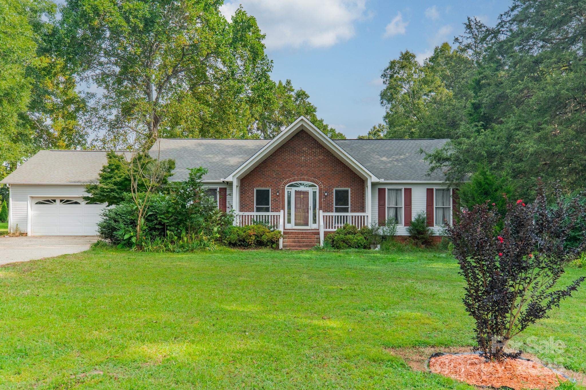 Looking for room to spread out....This 3-bedroom 2-ba home, located just inside South Carolina, offers a serene rural setting with a mix of wooded and open areas on 5 acres. Inside you'll find a spacious living area, large bedrooms, and a kitchen with beautiful oak cabinets offering tons of storage. A cozy rocking chair front porch and  back deck make the perfect spots for relaxing or entertaining. Plus, enjoy a beautiful all-seasons room that brings the outdoors in year-round. A huge 1768 sqft shop is ready for your projects, hobbies, or extra storage needs.  Close to the city to enjoy entertainment, shopping, dining, or sports events, yet this perfectly peaceful location provides the best of both worlds.  With a little bit of TLC and your personal touches, the home can be transformed into a stunning retreat.