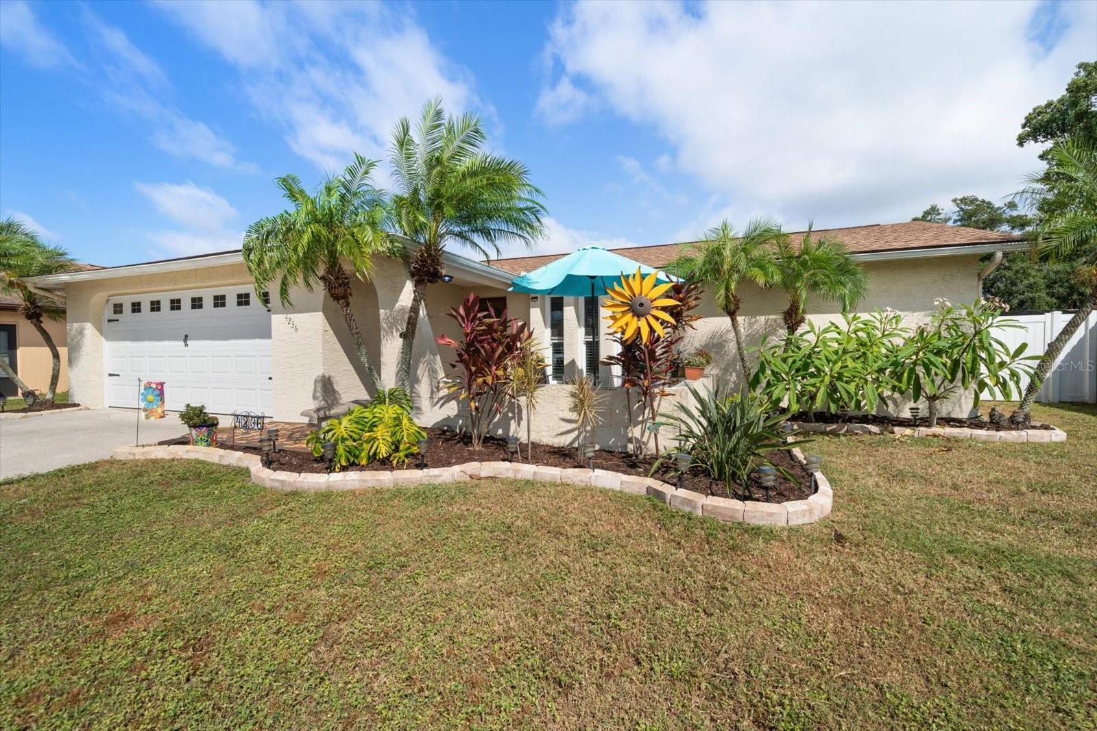 Located in the HIGHLY SOUGHT AFTER NEIGHBORHOOD of WOOD TRAIL VILLAGE, on a QUIET STREET WITH MINIMAL THROUGH TRAFFIC, this BLOCK CONSTRUCTION, NON-FLOOD ZONE, UPDATED & MOVE-IN READY, WELL-MAINTAINED SINGLE FAMILY HOME is ready for its new owner…YOU! Enter into FUNCTIONAL, OPEN PLAN kitchen, living and dining areas, which along with the SPLIT BEDROOM LAYOUT offers the perfect space for all. BRIGHT, NATURAL LIGHT throughout, with morning sun on the back lanai, gorgeous sunset skies to enjoy on the front patio and ATTRACTIVE GOVEE EXTERIOR LIGHTING to welcome you home after dark. PROPERTY AGES & STAGES (truly…move-in ready!) Brand new shingle roof (2025), fully renovated primary bath (2025), water heater (2025), garage door (2024), impact windows, living room slider, side garage door and lanai door to bath (all 2023), consistent ceramic wood-look plank tile throughout the home (2018), electric panel (2018), HVAC (2010). Stainless steel kitchen appliances include dishwasher (2025), range (2024), disposal (2023), refrigerator and microwave (2015). Superb location with EASY MAIN THOROUGHFARE ACCESS to…well everything! Shops, restaurants, parks, sports and recreation, airports, healthcare facilities, local markets, cultural events…and more! OPTIONAL membership in Wood Trail Village HOA. (Last known annual fee is $30). Be sure to VIEW THE 3D TOUR link for an immediate walk through experience, schedule your in person visit and make this very special home…YOURS!!