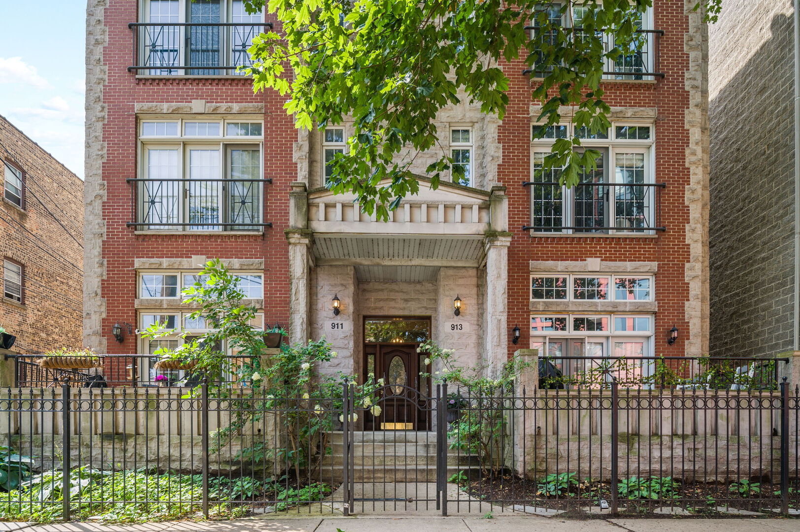 Enjoy the very best of Lincoln Park living in this super bright and spacious top-floor condo with soaring 14' vaulted ceilings and an extra-wide 20' interior. The open layout is filled with natural light from oversized windows and a Juliette balcony, creating an airy, inviting atmosphere even on a dreary day. Terrific kitchen was refreshed with newly updated cabinetry, a stylish glass tile backsplash, and newer stainless steel appliances. A large breakfast bar flanks the living area, where a cozy fireplace makes the perfect focal point for entertaining or relaxing. Refinished hardwood floors run throughout the well-designed home. The generous primary suite offers two walk-in closets and opens to a private deck-ideal for grilling, or unwinding after a long day. The spa-like stone bath features double sinks, a whirlpool tub, and a separate shower, plus a linen or storage closet.  The second bedroom is ideal for home office or guest room (or both!) while the ample closet space keeps the home feeling organized and clutter-free. All of this in a peaceful, top-floor setting with attached garage parking included. Steps from great restaurants, plentiful shopping, awesome nightlife, numerous parks, and all transit options -this sensational home puts you right in the heart of it all.