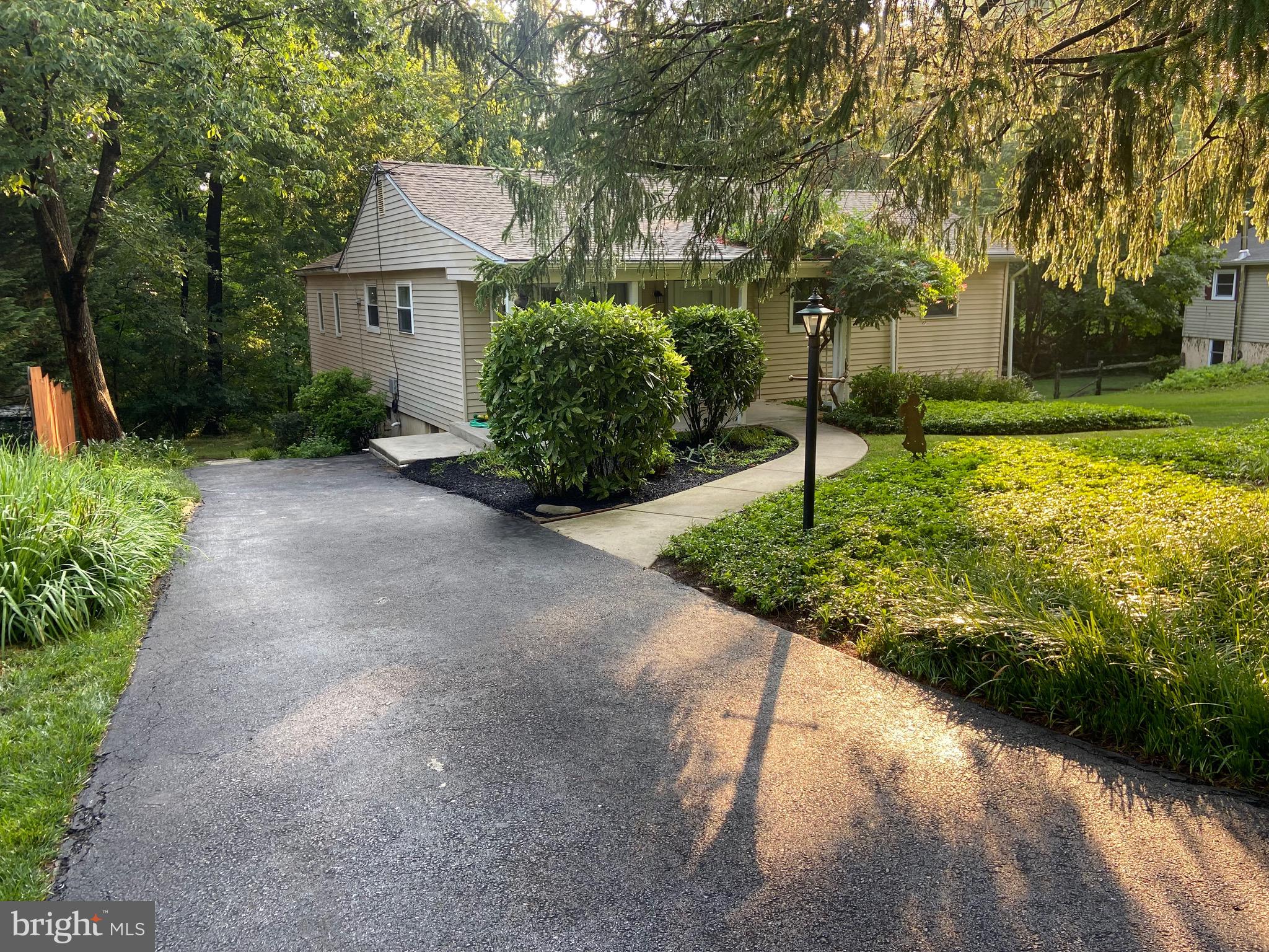 Here is a rare opportunity to own a single-family home in the Great Valley School District that may be less than your monthly rent! This home was recently appraised for $525k but priced to sell clean and quickly! It needs some updating but it has been well-maintained by the same owners for decades including two large additions! Located on a cul-de-sac with off-street parking are two bonus features that give this home a nice first impression. As you enter the covered front porch, you'll see mature landscaping that you can expand or reduce to any degree you want. You enter into the huge Living Room with hardwood floors. On this main level and to your right are two bedrooms that were extended during the most recent addition in 2005 including a very large primary bedroom.  A shared, Hall bathroom completes this part of the home. On the other side of the Living Room is the kitchen which is move-in ready or you can update at your own pace. Walk through the kitchen and you'll find the second addition (built in 1981) which is a huge Dining Room with hardwood floors and a sliding door to the large, 18'x12' deck. If you go downstairs, you'll find a storage, utility and laundry area which opens into two additional bedrooms with their own individual, wall-mounted, gas heaters! The first bedroom has its own half bathroom and built-in closets with a door that leads to a large, dry, unfinished room with egress windows to the yard. This extra room is perfect for storage or could be finished for a game room or office or whatever else you can imagine since it already has HVAC feeds. On the other side of the unfinished area is the fourth bedroom that also has a private half bathroom and exterior door to the driveway.  You'll have peace of mind with many features including a newer roof that was replaced in 2014. The gas water heater was replaced in 2022 and all windows have been replaced over the years of current ownership. You can move into this home immediately or you may choose to update at your own pace with your own decor. Either way, this Malvern single home is in the award-winning Great Valley School District and priced to sell quickly so don't wait to book your showing! The current owner wants you to enjoy this home as much as they did over the past 74 years, so hurry in and bring your imagination!
