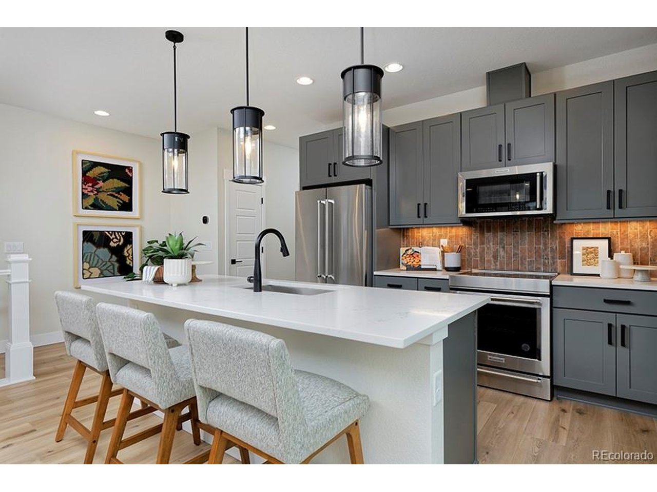 Neighborhood amenities at your front door. Residents enjoy access to a resort-style community pool and close proximity to the scenic trails and open space of Bluffs Regional Park, perfect for outdoor adventures and Colorado sunsets.Step into the perfect blend of comfort, style, and modern convenience with the Newton floor plan at Lyric at RidgeGate. This thoughtfully designed 4-bedroom home delivers the space, flexibility, and contemporary design today's buyers are looking for.A charming front porch welcomes you into an expansive open-concept layout built for both everyday living and easy entertaining. The spacious great room flows seamlessly to a private deck, perfect for relaxing evenings or hosting friends. The dining nook connects to a gourmet kitchen featuring sleek countertops, a center island, and premium stainless-steel appliances that make cooking and gathering effortless.Upstairs on the third level, the elegant primary suite offers a peaceful retreat with a spa-inspired bathroom, double sinks, and a spacious walk-in closet. Bedrooms two and three are also located on this level and share a well-appointed secondary bathroom, creating a comfortable and functional layout for family or guests.On the main entry level, bedroom 4 serves as a private guest suite complete with its own ensuite bath, offering ideal separation and convenience for visiting guests, extended family, or a quiet home office. This smart 4-bedroom design provides both flexibility and privacy across three thoughtfully planned levels.Buying new means modern design, energy-efficient systems, and the chance to personalize finishes to match your style-benefits resale homes rarely offer. Plus, when you use our preferred lender, receive $15,000 toward closing costs or a rate buydown, making homeownership even more attainable.There's still time to choose finishes that reflect your style. The Newton isn't just a home-it's the backdrop for your next chapter.