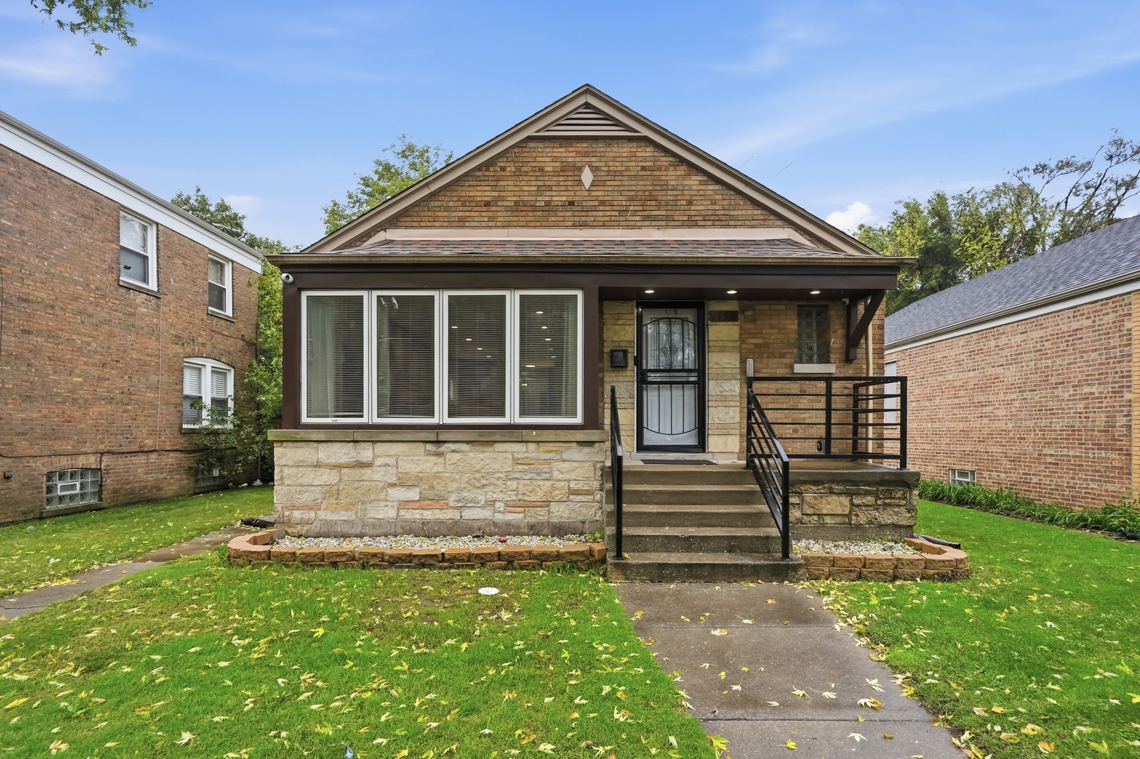 THE SPACE YOU NEED. THE FLEXIBILITY YOU WANT. THE HOME YOU'VE BEEN WAITING FOR! Welcome to 7450 S Bennett, a spacious 5-bedroom, 2.5-bath brick home in Chicago's South Shore neighborhood that offers so much more than meets the eye! Inside, you'll find beautiful hardwood floors, inviting living spaces, and a heated sunroom that adds the perfect touch of charm and comfort. But what makes this home truly special is the finished lower level featuring an in-law arrangement with its own kitchen buildout! Whether you're looking to create additional privacy for extended household members, accommodate overnight guests, or simply enjoy separate spaces under one roof, this layout offers options that traditional homes simply don't. Complete with a spacious backyard, detached garage, and convenient access to South Shore's lakefront, parks, shopping, and transportation, this property checks the boxes for both comfort and convenience. One address, endless possibilities, and room to make it all your own. Don't just imagine what life could look like here. Come experience it for yourself. Schedule your showing today!
