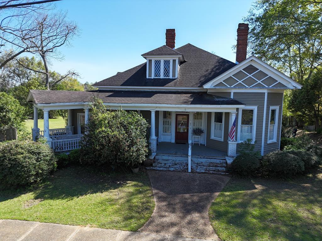 Step into timeless charm with this beautiful Victorian-style home located within the city limits of Pavo, GA—without the restrictions of a historic district. Situated on 1.35 acres, this property offers plenty of space to enjoy the outdoors while still being conveniently located in town. This character-filled home features 3 bedrooms and 2 bathrooms, along with elegant formal living and formal dining rooms that showcase the classic charm and craftsmanship you expect in a Victorian-style home. The kitchen is designed for both function and gathering, offering an island and a cozy breakfast room perfect for morning coffee or casual meals. The master suite includes a walk-in tile shower, adding a modern touch while maintaining the home's charm. Throughout the home you'll find unique details and character that make this property truly special. Outside, the 1.35-acre lot provides ample room for gardening, outdoor activities, or simply enjoying the peaceful setting. The property also includes an outbuilding and workshop, offering excellent space for hobbies, storage, or projects. If you're looking for a home full of character with room to spread out while still being in town, this Pavo property is a must-see.