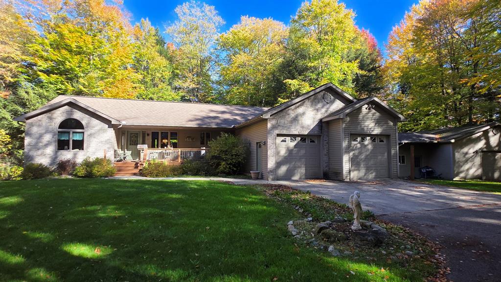 Don't miss the opportunity to own this special property in the heart of the Isabella County countryside. The home is tucked in the woods on the corner of the 10-acre parcel which consists of beautiful, wooded rolling hills. The main floor features a split floor plan complete with 3 bedrooms and 2 bathrooms. At the bottom of the stairs, you will find yourself in a plentiful recreation space or a second kitchen/dining/living area and an additional 4 bedrooms. That's right, this home has a total of 7 bedrooms and 3 bathrooms making it a convenient place to host gatherings of many kinds. The exterior provides a covered front porch. You can also step onto the back deck enjoy the abundance of nature all around. A two-car attached garage will provide parking out of the elements and easy access to the heart of the home. There is additional storage or workspace in the 40x28 pole barn just steps from the house.