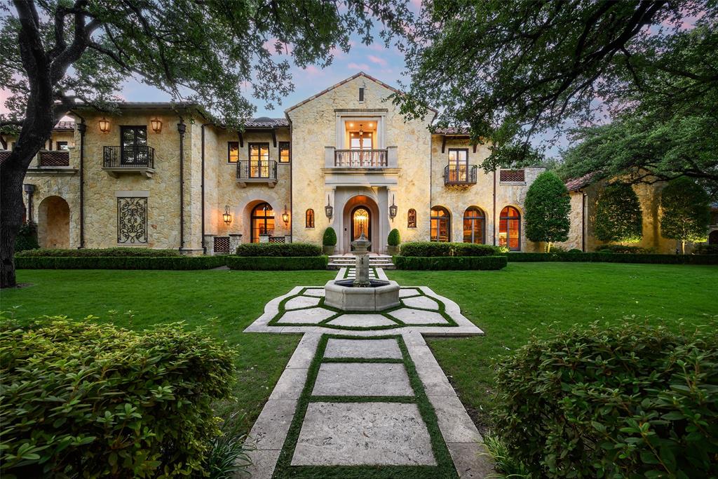 Inspired by the grand villas of the Tuscan countryside, this commanding, completely gated estate at 5335 Meaders Lane rests on a lot and a half.  Its expansive presence stretching nearly a block along one of Preston Hollow’s most admired neighborhoods in Mayflower Estates. Designed by noted architect Elby Martin and built by Bob Thompson, one of Dallas’ most respected high-end builders, this residence captures the soul of a Tuscan mansion with modern livability. From the Italian-barrel tile roof to stately stone exteriors, every detail feels authentic. Lush grounds unfold over 1.1 acres, enhanced by moonlit mature trees, two courtyards—including a private meditation garden—and four hand-crafted fountains. Multiple verandas, terraces, and six balconies—all with beautiful sweeping views—create effortless indoor-outdoor living. A resort-style pool with cascading spouts, a just-completed sport court, and a fully appointed cabana with kitchen, fireplace, and dome ceiling set the stage for year-round entertaining. The property also offers a 1,159 sq. ft. attached guest or au pair house with its own private exterior staircase and convenient parking pads. Inside, artistry and craftsmanship abound: a 24-ft ceiling entry with custom Solara iron stair, a 70-ft groin-vaulted gallery with hand-painted Italian frescoes, wine cellar and tasting room, billiard and game rooms, and a media room with motorized recliners. Clerestory windows frame sweeping estate views, underscoring the home’s connection to its surroundings. With geothermal HVAC, a recently installed whole-house generator, and thoughtful design, this is an extraordinary Tuscan-inspired retreat—expansive in scale, commanding in presence, and unrivaled in its Dallas setting.