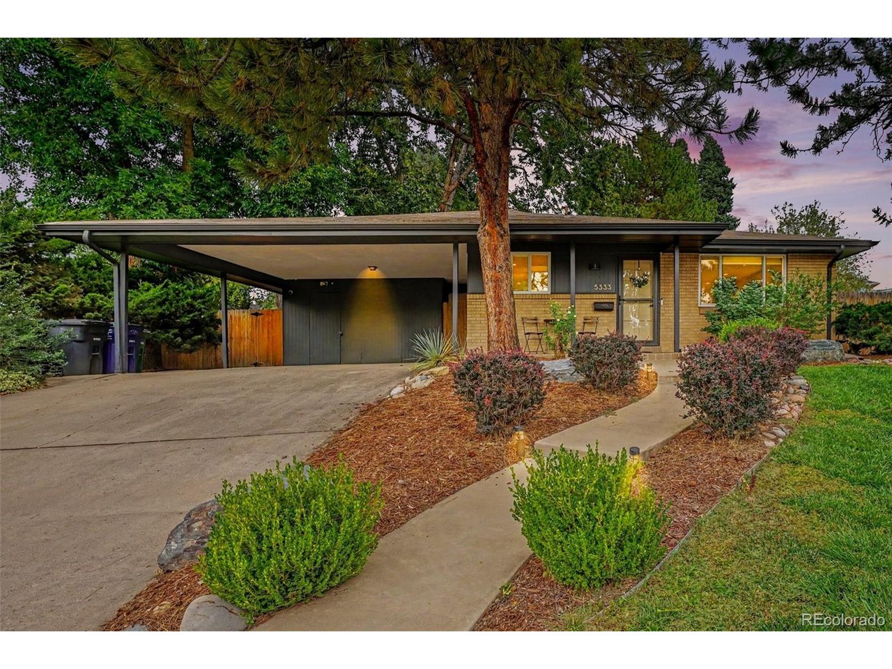 Mid-century style, modern updates, and an extraordinary garden setting come together in this beautifully renovated Bear Valley ranch. Set on an impressive .30-acre lot, this home offers something increasingly rare in Denver: space, privacy, mature landscaping, and a wonderful connection to the outdoors.The home's mid-century character shines through its clean lines, thoughtful layout, and abundant natural light, while tasteful renovations create a fresh, contemporary feel. The open main level features a beautifully remodeled kitchen with shaker cabinetry and honed black granite countertops, along with three bedrooms and a light-filled remodeled bathroom. The finished basement adds even more versatility with a large family room, fourth bedroom, 3/4 bathroom, laundry, and workshop/utility room.Outside, the lush lot is the true showstopper. Mature trees, fruit trees, and established gardens create a private urban retreat with plenty of room to entertain, garden, relax, and enjoy the seasons. Located in a quiet Bear Valley neighborhood, the home offers easy access to Bear Creek trails, shopping, restaurants, and everyday conveniences. Highway 285 is less than a mile away, providing convenient access to both the mountains and downtown Denver.A distinctive mid-century home on a truly special lot-offering character, privacy, and a lifestyle that's hard to find in Denver.