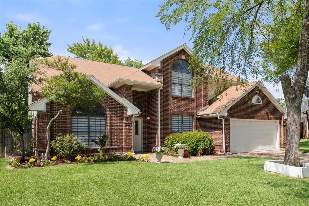 WELCOME to this STUNNING Move-in ready home with no HOA in desirable Glade Crossing. This home was remodeled and updated so the big-ticket items are already handled, including a new water heater (2026) and HVAC replaced in 2021. Kitchen, flooring, and bathrooms were all redone in the remodel, leaving a home that feels current the moment you walk in. The remodeled kitchen centers on an oversized island with seating overhang on three sides, finished with quartz countertops, a farmhouse sink, cabinet lighting, loads of counter and cabinet space, pull out cabinet drawers, and appliances replaced as part of the remodel. The kitchen opens to a living area where vaulted ceilings and a fireplace anchor the open floor plan. Loads of natural light from the front of the home flood into the second living area, and large dining room. And check out the gorgeous modern chandelier light fixtures throughout the first floor. The first-floor primary suite offers a walk-in closet, dual vessel sinks, and a huge, oversized walk-in shower with rain shower head. Rounding out the first floor is a convenient half bath and laundry room. Upstairs are two ample sized bedrooms, a full bath, plus a loft bonus room with a full closet. This flexible space can be used as an office, game room, media room, or easily a fourth bedroom. Ceiling fans, LED lighting, and smart switches were added in 2022, with exterior paint and refreshed landscaping the same year. Relax and enjoy the pergola in backyard with a bar, perfect for outdoor entertaining. Zoned to highly rated Grapevine-Colleyville ISD, and minutes from shopping and dining, with quick highway access toward DFW Airport and both downtowns. Check out this home. Look at the pictures. You won't be disappointed.