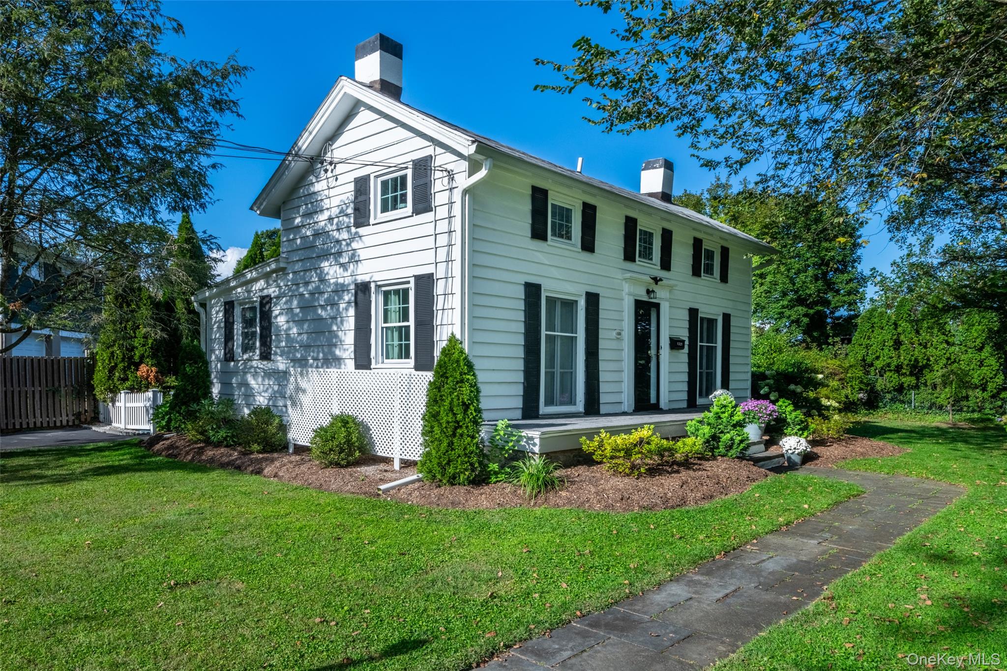 Bright and Charming Colonial in Harbor Knolls, Mamaroneck Village

Nestled in the highly desirable Harbor Knolls neighborhood of Mamaroneck Village, 1321 Crown Court offers the perfect blend of charm, comfort, and convenience. Located at the end of a quiet cul-de-sac, this sun-drenched Colonial is just moments from the village’s vibrant amenities—including restaurants, boutique shops, schools, the library, Emelin Theatre, Harbor Island Park and beach, and the Metro-North train for a seamless commute to NYC.

The main level features a spacious primary suite with a beautifully updated ensuite bath, a welcoming living room with exposed beams, a formal dining room ideal for entertaining, and a versatile guest bedroom or home office with its own ensuite bath. The modern kitchen opens directly to a private patio and fenced backyard—perfect for outdoor gatherings and relaxation.
Upstairs, you’ll find two additional bedrooms sharing a full bath, while the lower level provides ample storage and laundry area. This is a rare opportunity to own a move-in-ready home in the sought-after community of Mamaroneck.