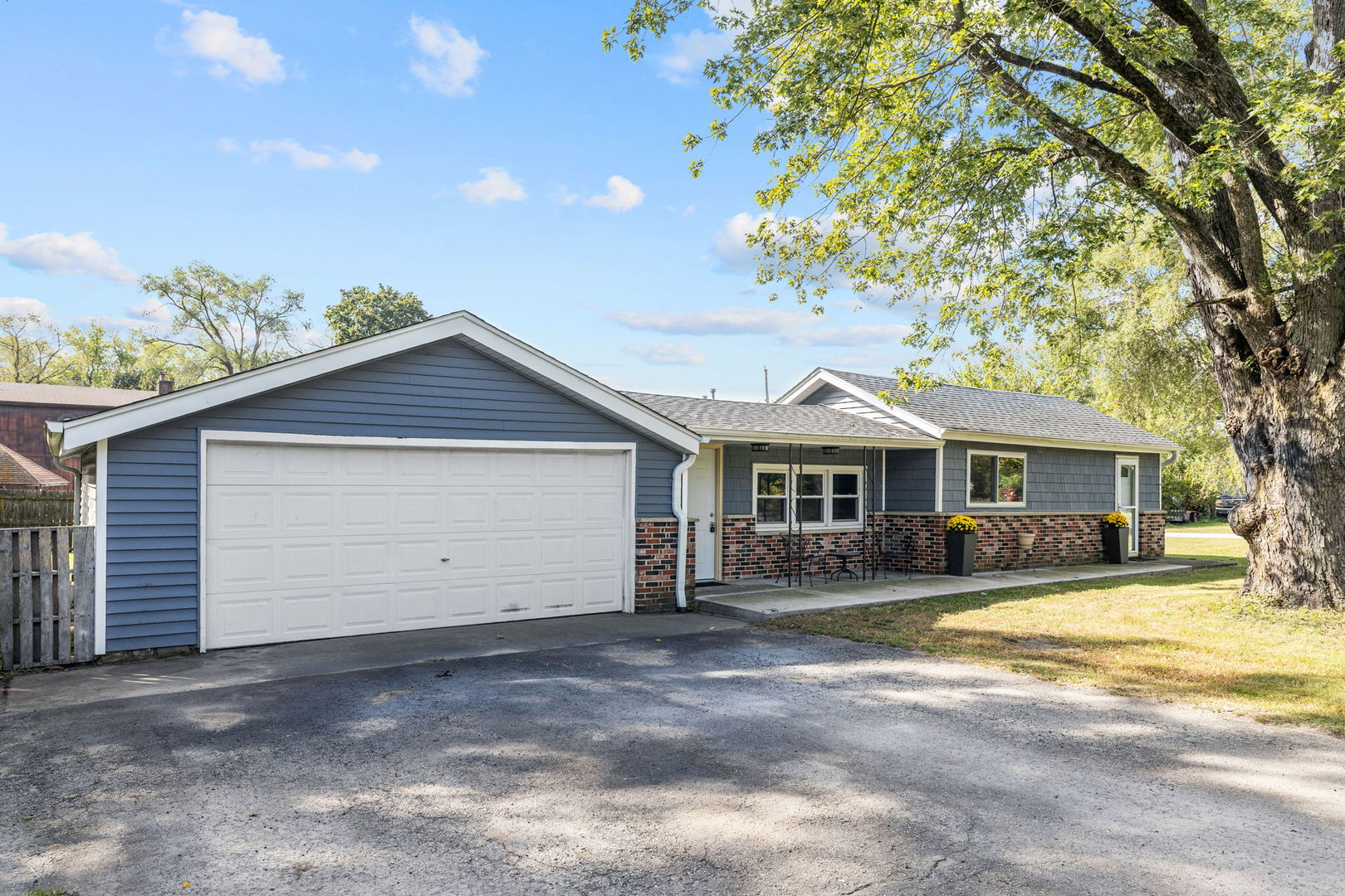 Welcome home! This charming and well-maintained 3-bedroom ranch sits on a corner lot and is completely turn-key, ready for its new owner. The open-concept layout features an eat-in kitchen with a breakfast bar that flows seamlessly into the light-filled living room. The primary bedroom includes an attached half bath, with two additional generously sized bedrooms nearby. A large full hallway bath and a spacious laundry/utility room add to the home's functionality.   The home sits on a crawlspace, professionally waterproofed by Permaseal. Recent updates include new floors, doors, trim, outlets, water softener, and well pump. Major updates in 2021 include a new roof, siding, windows, soffits, fascia, trim, gutters, and downspouts. 2.5 car attached garage is heated. Enjoy the fully fenced backyard in a quiet neighborhood. Don't miss the opportunity to make this move-in ready home yours today!