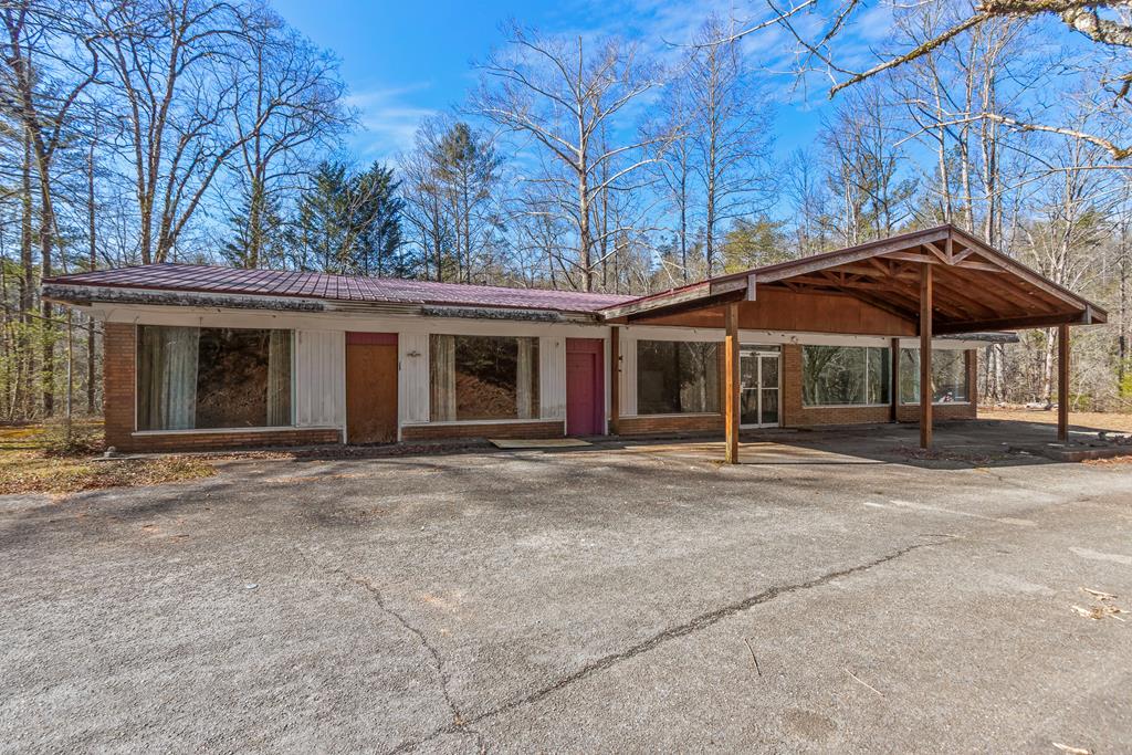 This former country store was built in 1960 and sits on a little over one acre with paved road frontage. It requires extensive repairs to be usable, presenting an opportunity to customize and restore to your liking.  With over 3,000 square feet of space, the possibilities are endless!