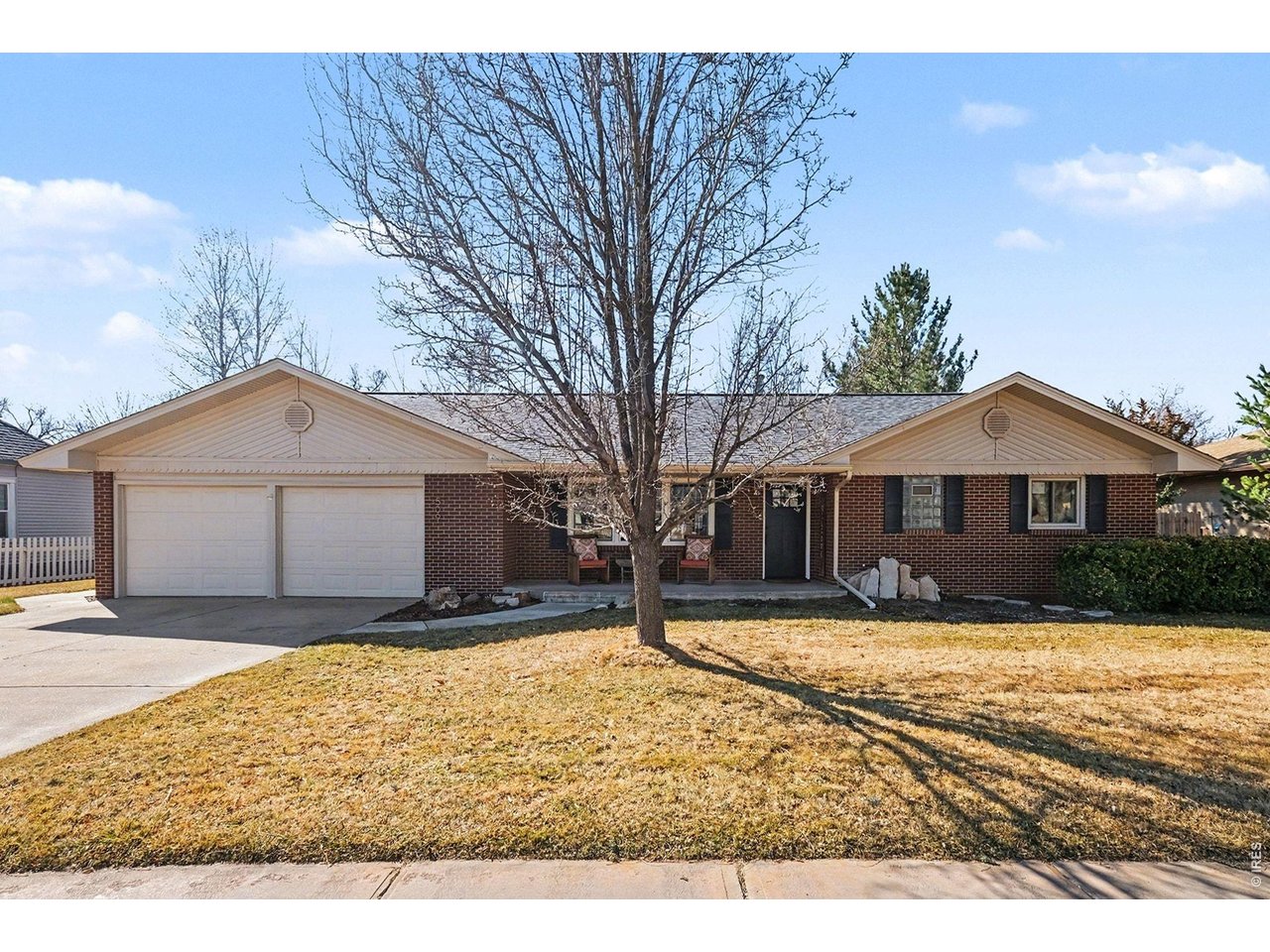 Beautifully updated home on a rare double lot in downtown Windsor! The location of this home is unbeatable - you can walk to schools, parks, restaurants, and Windsor Lake. The main floor has stunning hardwood floors that were recently refinished, as well as upgraded knotty pine doors and trim. The kitchen has newly refaced slow-close cabinetry, granite countertops, and stainless-steel appliances, including a gas stove. The bright, open living room includes a gas fireplace with a beautiful stone surround. The home has 2 bedrooms and 1.5 bathrooms on the main level. Downstairs, you'll find a family room, 2 additional bedrooms, and a recently remodeled full bath. The downstairs also has brand new carpet and new custom shelving in the family room. Outside, you will find a large, park-like backyard with mature trees and 5 irrigated garden beds. The 14-zone sprinkler system operates on a deeded irrigation well. In addition to the 2-car attached garage, the property has a 480 sq ft detached garage/shop with power and heat. Next to the detached garage, there is additional alley access parking with a 30-amp RV hookup. There is also a 201 sq ft studio with heat/AC and barn doors that open to a 222 sq ft stamped patio. Adjacent to the home, there is another 382 sq ft brick patio with a large covered pergola. This home has incredible outdoor spaces for entertaining or relaxing. The large lot and alley access parking create the potential to add an income generating ADU in the future. This is a rare opportunity to own one of downtown Windsor's most unique properties!