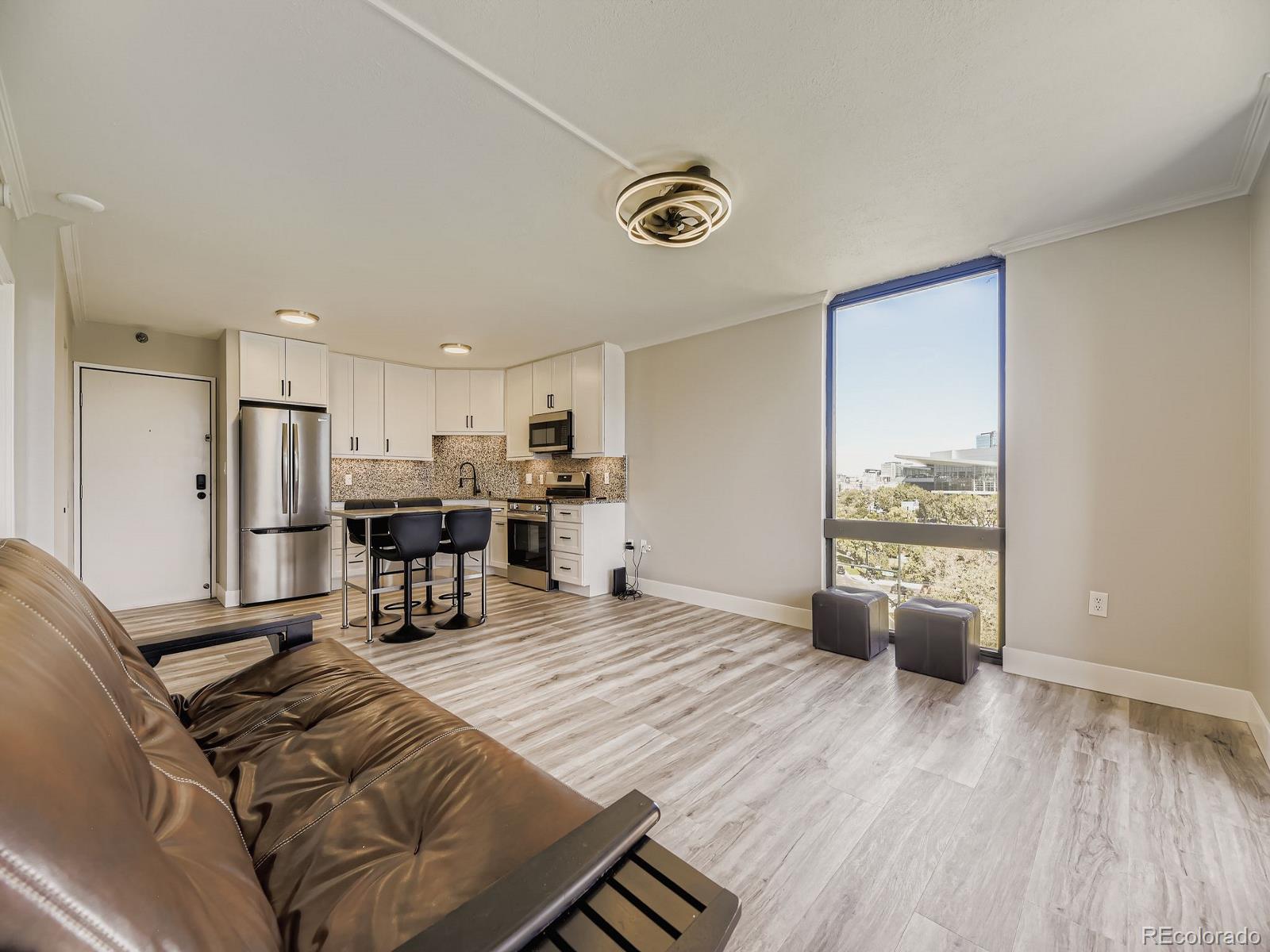 Impeccable 7th Floor Corner Unit With Mountain & City Views!! Update Kitchen & Bath!! Granite Counter Tops / 42" Cabinets / Stainless Steel Appliances / LVP Flooring / Ceiling Fans / Walk-In Closet / Frameless Shower / Soft Close Cabinets & Drawers / 2 Deeded Parking Spots #38 & #39 / Deeded Storage #4 / Security Entrance / Close To All Transportation, Cultural Arts, Walking Paths, Restaurants, Bars, Grocery Store Right Next Door!! Unit Amenities are Pool, Theater Room, Pool Table, Shuffle Board, Outdoor Fire Pit, Business Center, Large Fitness Area and Yoga Room!! Opportunity To Rent Out Parking Spaces ($150 For Each Spot) To Subsidize HOA Payment!! Property Qualifies for a $17,500.00 Grant!!