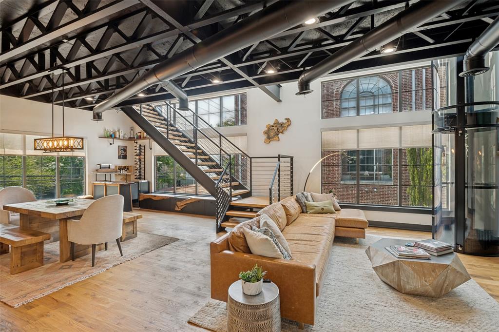 Discover one of Dallas’ most distinctive luxury residences, where industrial modern design meets exceptional indoor-outdoor living. Completely remodeled with curated designer finishes and over $400,000 in upgrades, this stunning corner unit townhome features white oak hardwood floors, soaring ceilings, dramatic architectural details, and light-filled open living spaces with views from three sides. The chef’s kitchen is equipped with gas stove tops, double ovens, and 2 pantries for generous storage, while the thoughtfully designed floor plan offers both comfort and privacy.A one-of-a-kind private tube elevator carries you to an extraordinary rooftop with an incredible 360° view of the Dallas skyline. This residence is an entertainer’s dream, complete with an outdoor kitchen, hot tub, gas fire pit, weather-rated TV, and multiple beverage refrigerators. Every detail has been carefully considered to create a truly turnkey urban retreat unlike anything else on the market.