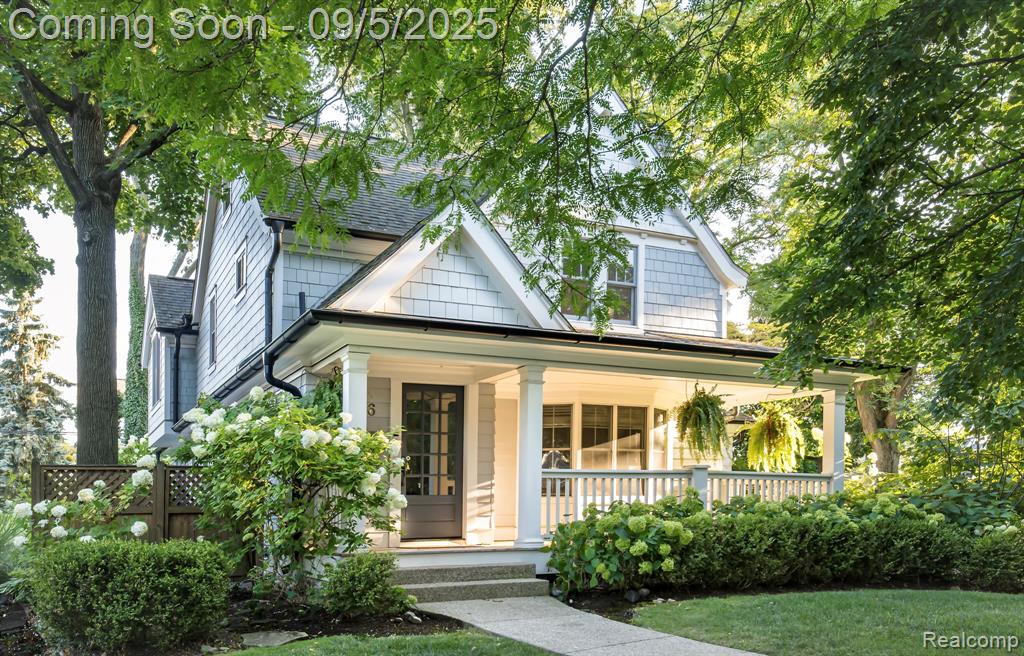 Expanded and renovated in 2007, this Poppleton Park gem seamlessly blends classic charm with modern updates. Enjoy an enchanting front porch, a welcoming living room with fireplace, and a formal dining room with a butler’s pantry. The generous family room connects to a windowed turret sitting area with stone flooring. The granite chef’s kitchen features premium appliances, a central island, a sunlit breakfast nook, and a command center, while the large mudroom includes a convenient lavatory. The exquisite primary suite has vaulted ceilings, a walk-in closet, private balcony, and a two-way fireplace to the marble spa bath—complete with soaking tub, shower, double vanities, and a separate commode room. Additional spacious bedrooms include one with a private sitting room. Upper-level highlights include a second-floor laundry and walk-up access to the third floor. Both front and back staircases add to the home's thoughtful layout. The lower level under the addition is fully excavated with high ceilings and an egress window. The original basement provides abundant storage, a craft room, and a second laundry area. Set on a private corner lot with beautifully landscaped gardens, this home offers an unmatched Poppleton Park lifestyle—walkable to downtown Birmingham, surrounded by parks, close to top public and private schools, Forest Lake Swim Club, and best of all, wonderful neighbors.