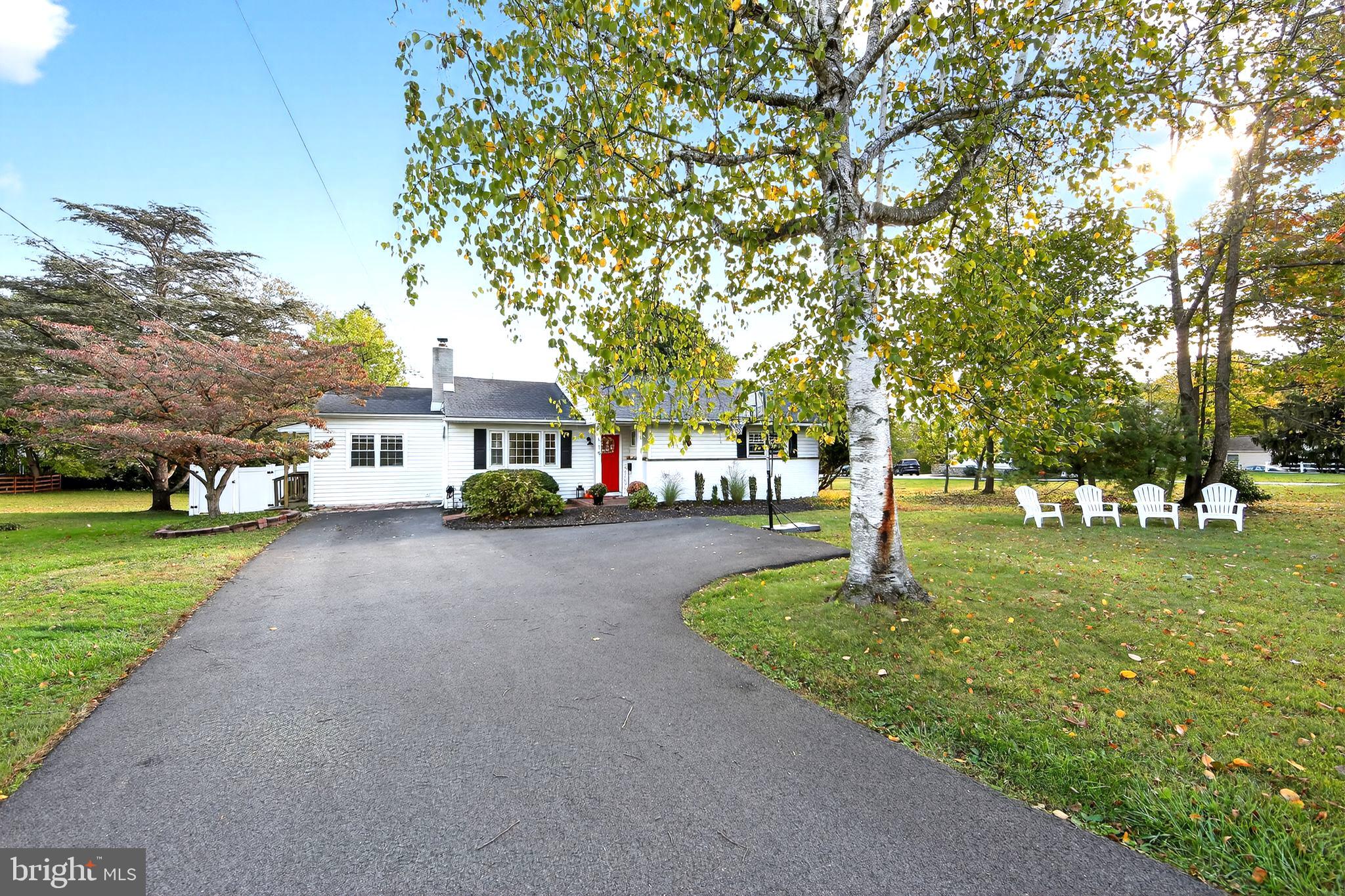 OPEN HOUSE CANCELLED! Welcome to first-floor living on a beautiful level lot in T/E!This 3-bedroom, 2.5-bath ranch home is nestled in the desirable Waterloo Farms neighborhood of Berwyn. Step inside to find hardwood floors throughout and an abundance of natural light. The inviting living room with a wood-burning fireplace opens to a spacious kitchen and dining area, perfect for everyday living and entertaining. The kitchen offers generous counter space, a custom island with seating, and French doors that lead out to a deck with a fenced-in backyard. Just off the main living area, is a dining room and a versatile room with a side entrance currently serves as an office and mudroom. On the opposite side of the home, the expanded primary suite features a walk-in closet and recently renovated private en-suite bath. Two additional sun-filled bedrooms offer plenty of closet space and versatility for guests, family, or a home office setup. One bedroom includes a private half bath, and the updated hall bath with a tub adds comfort and style to this thoughtfully designed main level.  The lower level offers a playroom, workout space, laundry area, and workshop/mechanical room. This move-in ready home offers a perfect combination of simplistic living with a great backyard, and a walkable location near shops, restaurants, a public library, and community fields—all within the top-rated T/E School District. Schedule your showing today!