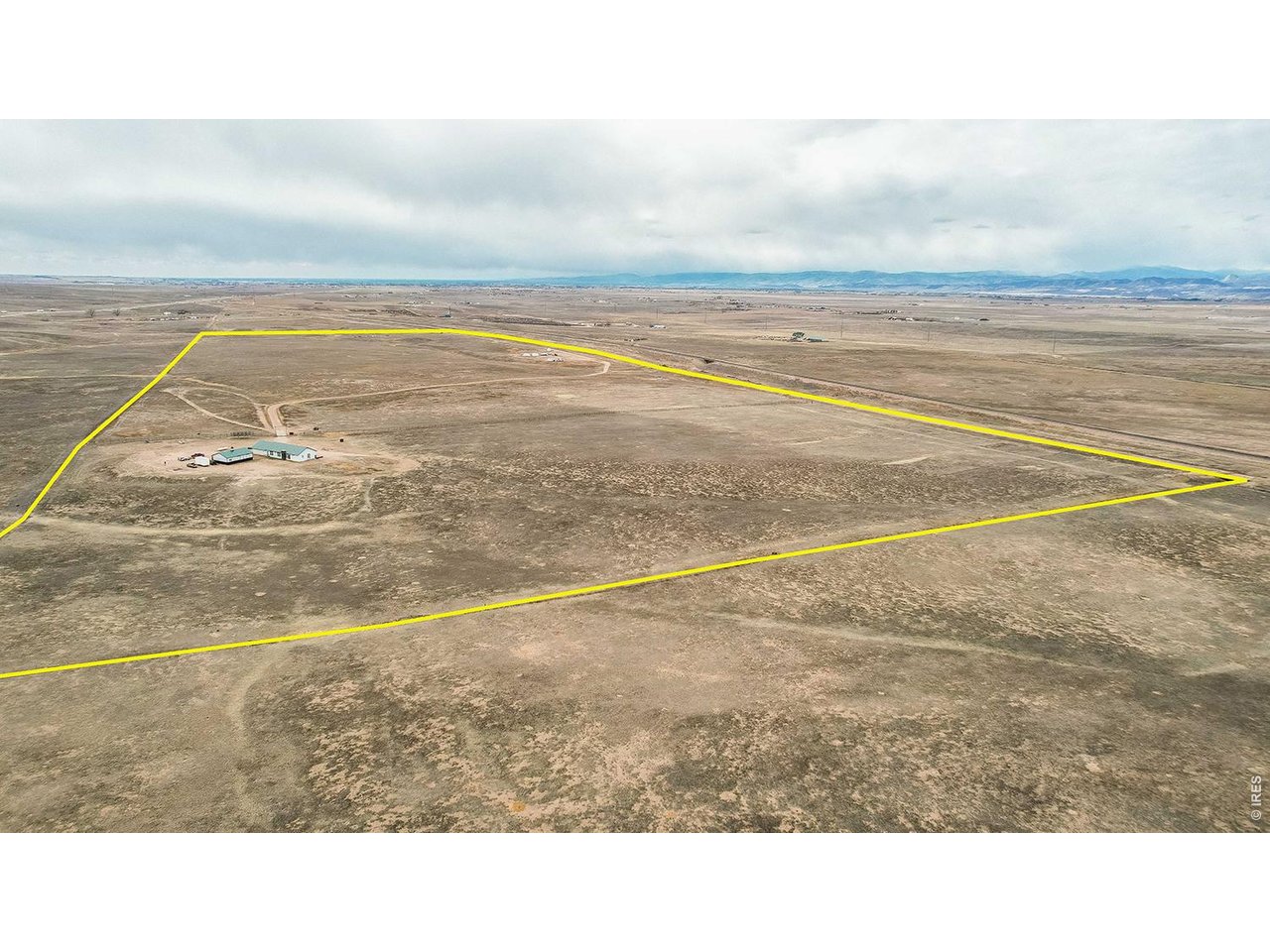 Mountain views, acreage fully fenced, off-grid home, 30x40 shop plus oversized 3 car attached garage, horse property, Colorado living. Experience true independence with this 100% off-grid property designed for comfort, functionality, and wide-open space. Situated on expansive, fully fenced 96 acreage (divided into 30-acre fenced sections), this property is ideal for horses, livestock, or anyone seeking privacy and room to roam, all with unobstructed mountain views. The home features 3 bedrooms plus a dedicated office, 2.5 bathrooms, and a spacious laundry room. Inside, you'll find hardwood floors, granite countertops, a butcher block island perfect for gathering, knotty alder trim, shiplap accents, and upgraded lighting throughout. This home feels elevated. Enjoy energy efficiency and reliability with a solar-powered system, brand new batteries (2026), a 1,000-gallon owned propane tank, backup Generac generator, and two wells providing dependable water access.Car enthusiasts and hobbyists will appreciate the oversized 3-car attached garage plus an additional 1,200 sq ft shop with space for up to 4 vehicles, along with ample room for RVs, boats, and recreational equipment.
