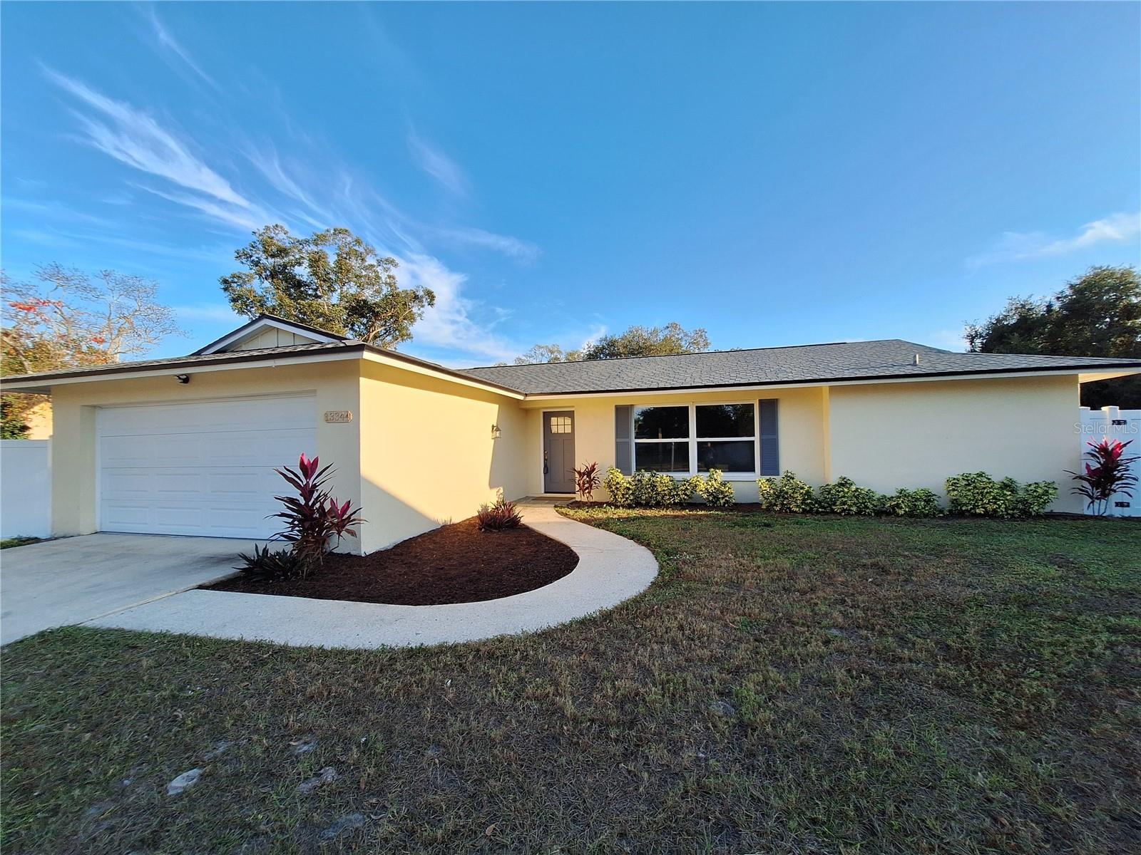 Nestled in the heart of Pinellas County is this spacious and charming 1,991-sq-ft home which has been renovated from the light switches to the roof. Interior is in neutral colors. This 1973 home has been inhabited by the same family for nearly 53 years. Now, for the first time in decades it's ready to welcome a new owner who will appreciate it's openness, character and unbeatable location. From the moment you step inside you'll feel and experience the spaciousness of a free flowing open floor plan. This 4 bedroom home offers a well-designed split plan. On one side you'll find two comfortable bedrooms that share a conveniently located full bathroom with tub and shower-perfect for family or guests. The master suite with full bath is privately situated on the opposite side providing an added restful space. The fourth bedroom is set toward the back of the home offering flexible use as a guest room, office or hobby space. Altogether the layout provides both privacy and practicality for a variety of living arrangements. The centrally located kitchen is the heart of the home with the inviting dining room opening to one side, and living area to the other ideal for daily living and entertaining. The newer renovated home is now laid out as open and free flowing with abundant natural light. Lots of room to spread out! Newer features: Rheem hot water heater 2025, Shingle Roof and Modified Bitumen Flat Roof System July 2023, Appliances 2023, Laminate Flooring 2023, Kitchen Cabinets with Island 2023, Replaced 200 AMP Main Panel 2023, HVAC March 2022, newer Windows. Just over 2,500 total sq. ft. includes an over sized 2 car garage with upgraded overhead door. Newer windows. Property is located in a peace of mind non-evacuation flood zone and flood zone X which does not require flood insurance. Pinellas County Schools is an "A" rated district. Near by is Walsingham Park lined with mature trees, open green spaces, walking paths and lovely lake settings are perfect for unwinding in nature without having to go far, a mere 7 minutes by car. The Southwest Recreation Complex is a vibrant community hub offering something for every age and interest. Known for its exceptional aquatic program the facility features competitive swim teams as well as aquatic classes for all skill levels. Beyond the water the complex includes a fully equipped fitness center. For outdoor enthusiasts there are well maintained tennis courts and dedicated Pickleball courts. A well rounded and welcoming environment for everyone just minutes away! This kind of home belongs on your must-see list! Immediate occupancy!