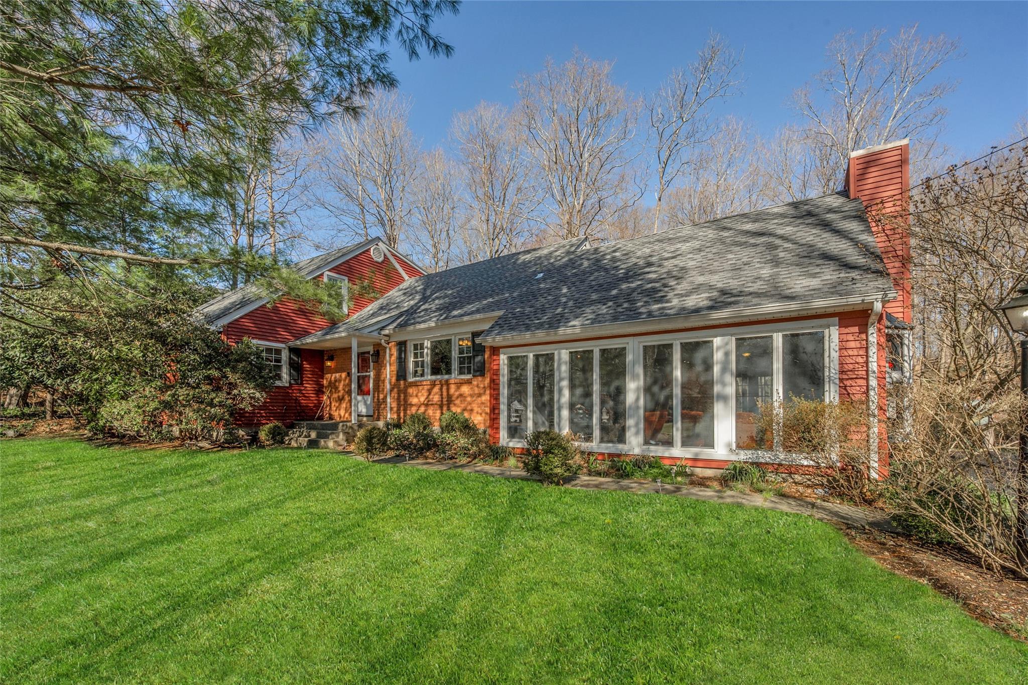 This original model home in the Katonah Ridge community boasts all the extras, offering a blend of charm, space, and functionality. Lovingly maintained for years by only its second owner, this home features four bedrooms and three baths, including two primary suites—one conveniently located on the first floor. The eat-in kitchen overlooks a scenic pond across the street, while the spacious family room is bathed in natural light with walls of windows and a cozy fireplace. A large screened-in porch provides the perfect spot to enjoy the serene backyard. The formal dining and living rooms offer elegance and warmth, complemented by a second fireplace. Upstairs, the expansive primary suite impresses with vaulted ceilings and hardwood floors beneath the carpet. Storage abounds throughout the home, including a generous walk-in attic with additional space to create another room. With endless possibilities and a prime location just minutes from downtown Katonah, this home offers a comfortable lifestyle with an easy commute to NYC.