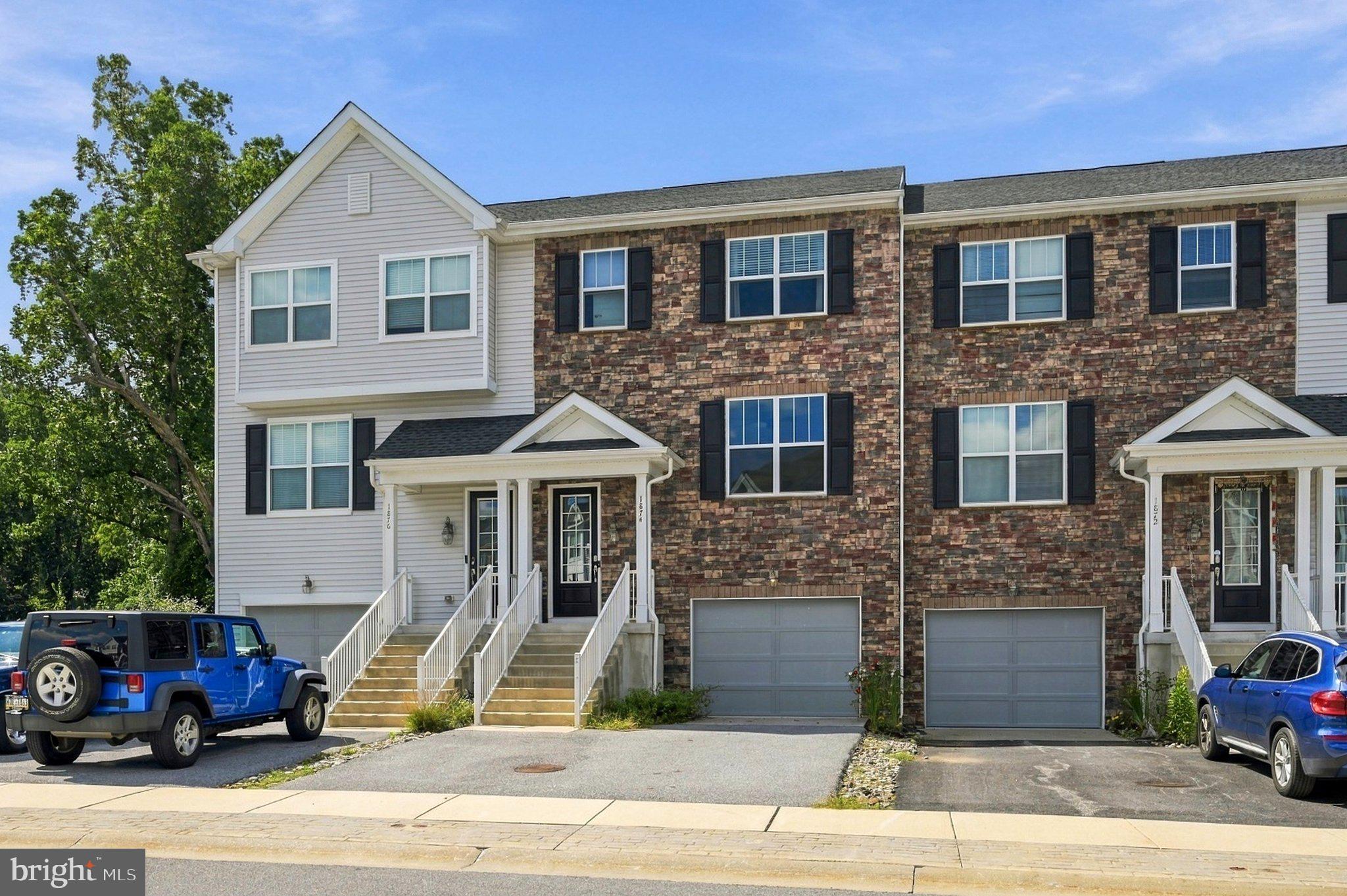 Beautiful east-facing townhome loaded with upgrades in the desirable Townes at Shannon Hill community. This sun-filled home features engineered hardwood flooring, newly painted walls, new carpet, window blinds, a whole-house water softener, and ceiling fans throughout.Enter through a dramatic two-story foyer with hardwood floors, a powder room, and coat closet. The main level offers a bright, open-concept layout with 9’ ceilings, a spacious family room, dining area, and gourmet kitchen featuring 42” soft-close cabinets and a breakfast area that opens to a private deck with scenic views.The upper level includes all bedrooms and a convenient laundry area. The primary suite features a tray ceiling with recessed lighting, dual walk-in closets, and a luxurious primary bath with double vanities and a seated shower.The lower level offers a finished recreation room with walk-out access to the backyard and direct entry from the oversized 1.5-car garage. A private driveway and ample guest parking provide additional convenience.Prime location near Routes 30 and 322, shopping, dining, and major corporate centers. Conveniently located minutes from Thorndale and Paoli train stations, offering direct service to Philadelphia. Situated in the highly rated Downingtown Area School District and within walking distance to United Sports.