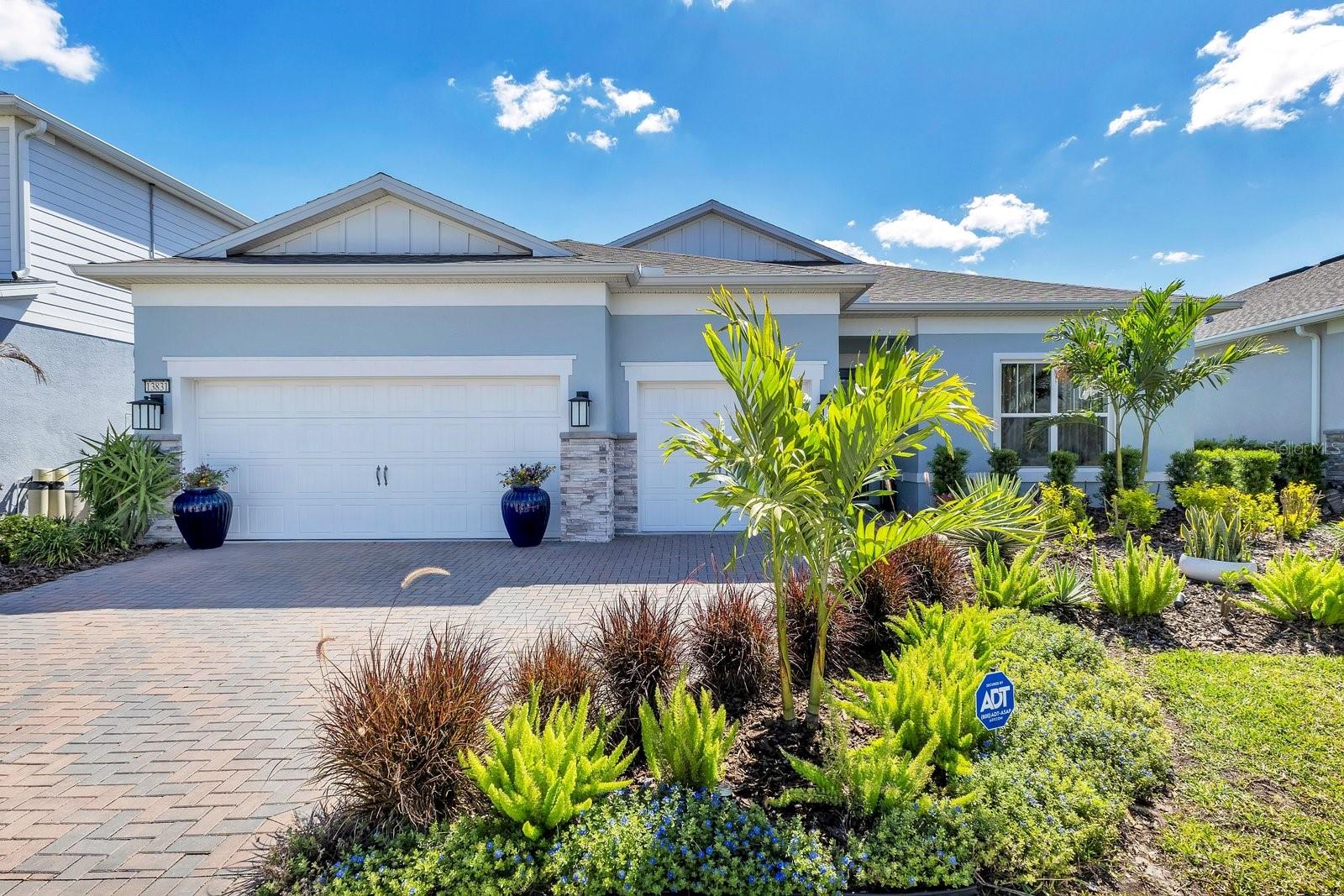 Welcome to elevated lakefront living in the heart of Isles of Lake Nona, widely recognized as one of the most sought-after communities in the area. Perfectly positioned along a tranquil stretch of water, this stunning single story residence boasts approximately 60 feet of beautiful water frontage, offering picturesque views and a serene backdrop for everyday living. Thoughtfully designed with both elegance and functionality in mind, the home features a bright, open-concept layout, high ceilings, filled with natural light. The spacious living and dining areas flow seamlessly into a beautifully appointed kitchen, complete with sleek countertops, abundant cabinetry, and an oversized island—ideal for both casual living and gracious entertaining. Designed with a desirable split floor plan, the private primary suite provides a relaxing retreat with peaceful water views, a spa-inspired en-suite bath, and generous closet space. Additional bedrooms provide comfort and flexibility for family, guests, or a home office. Step outside to enjoy the true highlight of the property—60 feet of waterfront, creating a breathtaking setting for morning coffee, evening sunsets, or future outdoor living enhancements. The backyard presents a rare opportunity to create your own private oasis, complemented by serene views and a motorized screen for seamless indoor-outdoor living. A spacious three-car garage provides ample room for vehicles, storage, or hobby space. Exterior repainted in 2024 with premium, high-end paint, enhancing both beauty and durability, as well as french drains installed to improve drainage and prevent rainwater pooling. Located within minutes of the vibrant Lake Nona Town Center, Medical City, and Orlando International Airport, residents enjoy convenient access to premier dining, shopping, parks, and major highways while experiencing the lifestyle that makes Lake Nona one of Orlando’s most sought-after communities. Discover the perfect blend of waterfront tranquility, modern comfort, and prime location—schedule your private showing today.