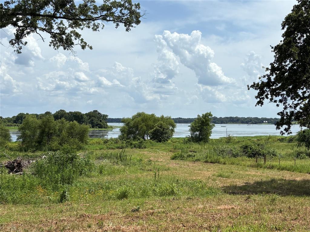 If you are searching for that hidden private getaway spot on Lake Fork, Hit the brakes! Here is a surveyed 10 acre tract with approximately 18 ADDITIONAL  acres of SRA leaseback for a total of approx 28 acres to enjoy. This unique hard to find property is located at the Glade Branch area of Lake Fork and near the end of dead end road for additional privacy. This tract has good building spots for a new home among the scattered Oaks and a beautiful view of the lake. Property currently has ag exemption and offers some hay and grazing opportunity also. Ready for a new home, mobile home, tiny home, RV or just a property to go camping, hunting or recreational getaway this place will work. With NO KNOWN RESTRICTIONS there is unlimited opportunity in this property for the buyer. The property has 100' surveyed entrance with private gate and access and some dirtwork for pad site already done. The SRA property borders the creek on the south and the lake on the west for a tremendous amount of  water frontage. There is a small pond on the SRA lproperty also. All utilities are available at the road with City water line and electricity!  Hidden diamond in the rough! Seller has a survey and is ready to close.