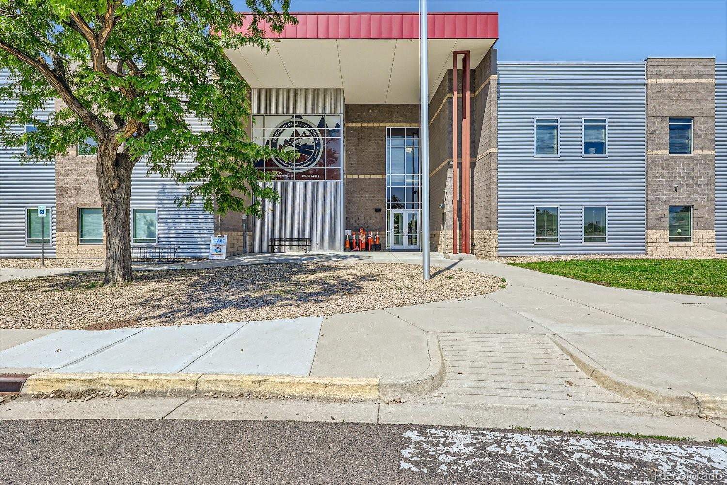 This 69,811 SF school built in 2006 by Ability Connection Colorado has been subdivided into two separate schools. Currently, Vanguard Classical Charter School, the tenant in place since 2007, has a current lease through June 2027 in the 45,564 SF portion of the building being offered For Sale. Vanguard has an enrollment of over 300 students in Grades K-8, with the capacity to grow to over 500 students in the space.

The property is available as an investment or for the school owner-user group who would like to occupy the property once the lease reaches expiration. The owner of the property, ACCO, operates in the remaining ~24k square feet and has subdivided the building to create a “condominium” within the building which they are offering For Sale.

100% leased through June 2027 providing income
Modified Gross lease for annual income of $911,280
110 shared parking spaces (additional parking available at church neighbor)
Elevator, sprinkler system, and life/safety/alarm systems
Full gymnasium/multi-purpose room with stage/tiered-level computer lab
Fenced outdoor playground