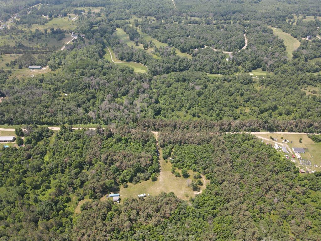 Located in Crawford County just South of Grayling. There are multiple 2.5 ac lots being sold as one that total 17.5 acres. Conveniently located just off of I-75 at the 4 mile road exit, this property backs up to the Patriot Golf Course on the West Side and a large tract of State Land on the East side.  A 2022 Reflection 150 Series 5th wheel is included with the sale.  Power, water and septic are all connected.  Additionally, there is an older barn and a 40' storage container onsite. Great place to camp, hunt, build or just invest in for possible development or campground. Dial the Listing Agent number directly for more information.All map lines are approximate and not to be used as a survey Current use is Hunting,Recreational.