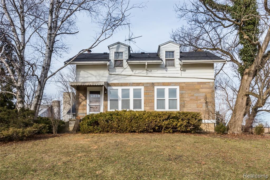 Presenting a lovely Cape Cod-style home set on over an acre of serene farmland in Lodi Township, just minutes from downtown Ann Arbor and Saline. This 1,625 sq ft home features three bedrooms and three full bathrooms, including a main-level primary suite, and is full of character and warmth. The kitchen offers a dining area, double oven, and tile backsplash, while an upstairs bedroom has built-ins. Cozy wood-burning fireplaces are found in the family room and basement with brick surround. A welcoming front porch, warm original wood trim and doors, and the full basement awaiting your finishing touches add to the appeal. The home also includes a new roof (2024), detached 2-car garage, and sits in the highly regarded Ann Arbor School District. No HOA, offering privacy and tranquility while remaining close to shopping, dining, University of Michigan football games, and I-94. Move right in!