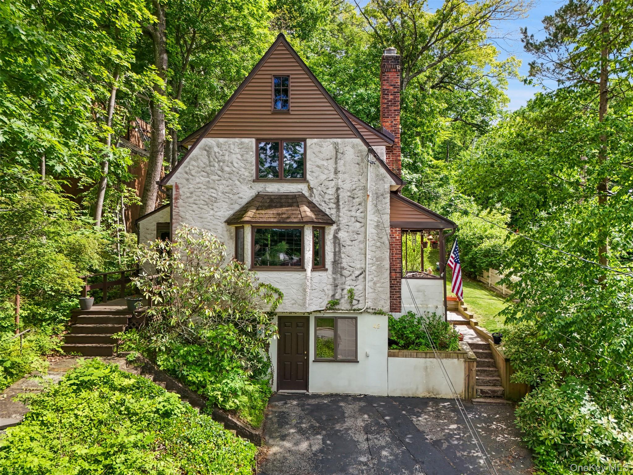 Your Opportunity to Own in the "Big Little Village" of Mount Kisco. Over the past year, only 42 single-family homes in the Bedford Central School District have sold in Mount Kisco—and just six sold below $650,000. This is your chance to become a homeowner in one of Northern Westchester's most desirable communities and enjoy everything the "Big Little Village" has to offer.Ideally located on a quiet street with no through traffic, this 3-bedroom, 2-bath home offers solid bones, endless potential, and a location that's hard to beat. Hardwood floors run throughout the home, while the tiered backyard provides a wonderful outdoor retreat featuring a comfortable stone patio—perfect for relaxing, entertaining, or enjoying the property's breathtaking unobstructed sunset views.Enjoy the convenience of village living with a short walk/stroll or bike ride to downtown Mount Kisco's restaurants, shops, grand parades, community events, and the beloved Mount Kisco Diner. Commuters will appreciate being just a 17-minute walk/stroll or a quick 5-minute bike ride to the Metro-North train station.Improvements have already been completed, including replacement of all original windows in 2006 and a new roof and gutters installed in 2014, complete with a lifetime warranty. Gas stove in kitchen. Additional features include wiring for a security alarm system, outdoor camera capability, and a motion-sensor light by the driveway.Bring your vision and personal touches to make this home your own. With its unbeatable location, strong fundamentals, and exceptional value in today's market, this is an opportunity not to be missed. IMPORTANT NOTE: Actual HOUSE NUMBER is 42 THORN- tax records differ from house address.