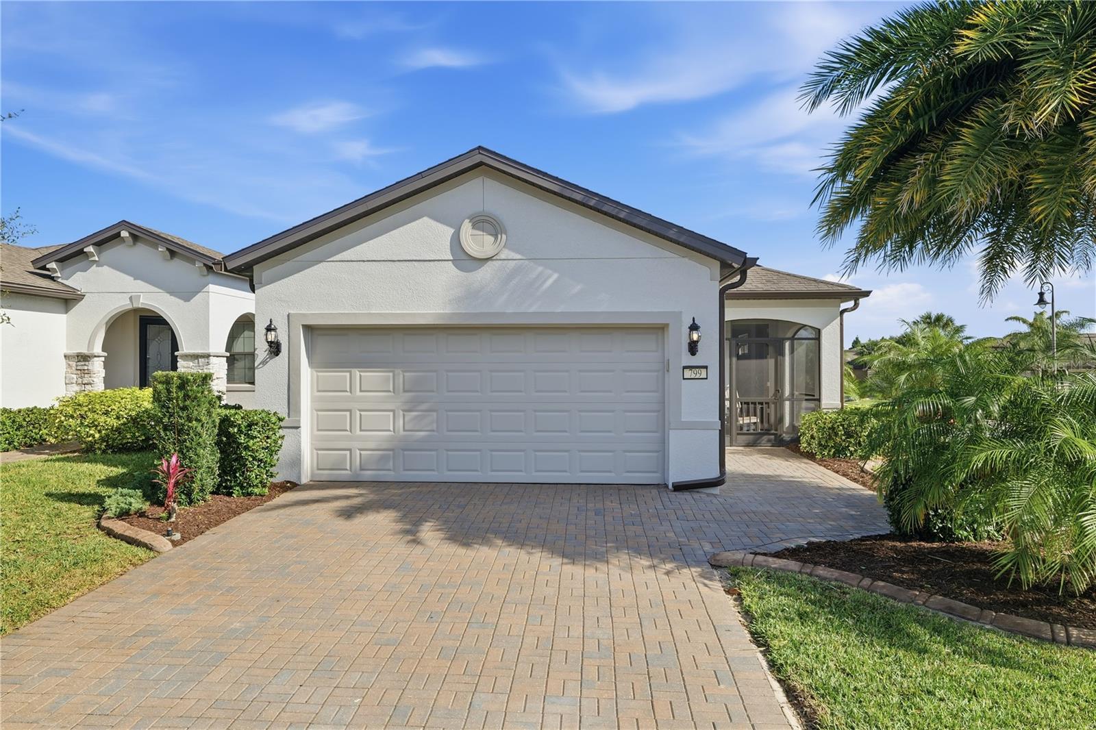 Enjoy this Bright and Beautiful Noir Coast Home by Pulte. Built in 2018and part of the Del Webb community of Orlando with all of its amenities foractive 55+ members this unique corner lot boasts full sun and two owneradded solar sun lights by Solatube. The current owners also added twoshort curving planter walls suitable for flowers anchored by a SylvesterPalm and Foxtail Palm, a new (8/25) high-end variable speed inverter-driven split HVAC system by Daikan with a transferable 12-year warranty.The home has been completely repainted inside and out, and stylishdecorative concrete curbing and landscaping have also been added in thelast two years.Two well-sized bedrooms are again lit with even more windows, the primaryhaving a long dual vanity and large walk-in closet. Relax throughout yourday on two screened lanais, the front added by the current owners faceswest, and the rear lanai faces east to catch the rising morning sun. Theliving room is bracketed by large sliding glass doors and the open view intothe kitchen where there is ample space for a table and seating for 4. TheNoir Costs model home includes a large walk-in laundry room andcommunications/internet panel hidden in the wall.This must-see priced-to-sell home is located just 3 miles south of I-4 andjust 14 miles from Disney. The home has been a single family vacationhome for the past 5-years and the owners have spared no expense makingnumerous high-end updates. Including multiple ceiling mounted hanginggarage storage racks suitable for seasonal decorations and storage bins.
