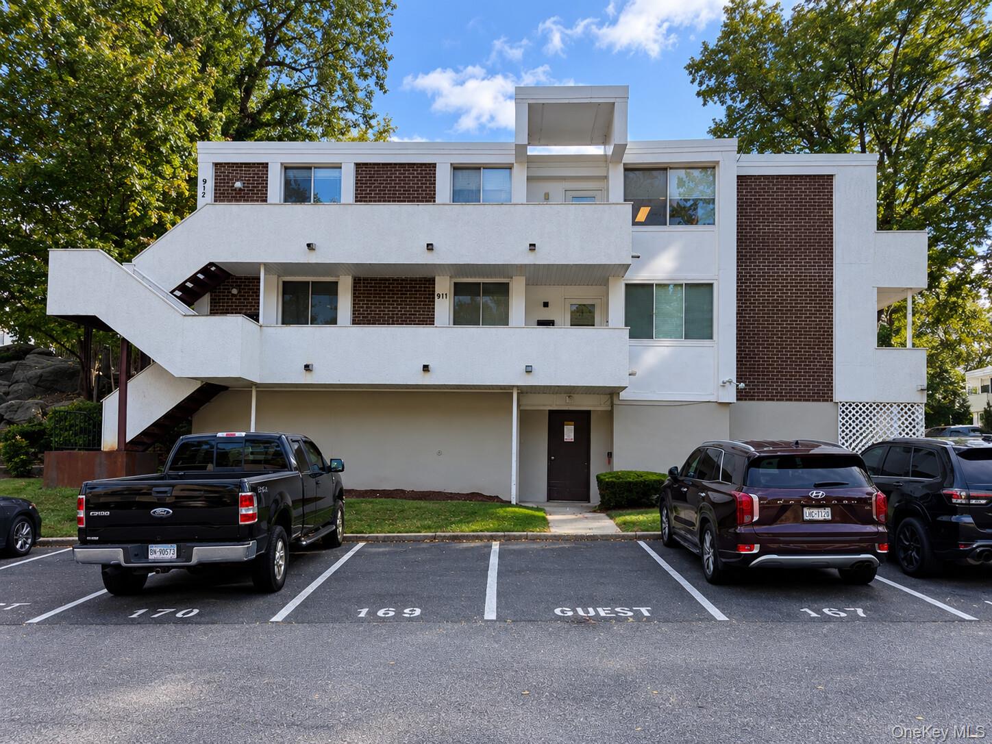 Top-floor living in the heart of Hartsdale. This bright and spacious 3-bedroom, 2-bath condo sits on the 3rd floor with no upstairs neighbors, two private balconies overlooking mature tree canopy, and a rare private entrance that sets it apart from the rest of the building. Hardwood floors throughout. The kitchen has been updated with white cabinetry, black granite countertops, and stainless steel appliances. Full-size washer and dryer in unit. One assigned parking space included. Pet friendly. Community pool and beautifully maintained grounds make coming home feel easy. Walk to Hartsdale and Scarsdale Metro-North stations for a 40-minute commute to the city.