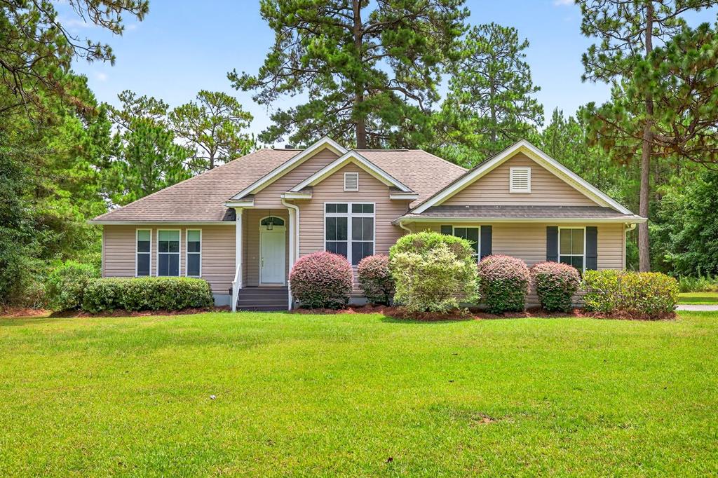 Nestled on nearly 2.7 serene acres in the peaceful Beachton area, 197 Beachton Ridge Drive offers the perfect blend of privacy and comfort. This charming single-story home, built in 2004, features over 2,100 square feet of living space with 3 bedrooms and 2 spacious bathrooms, a cozy fireplace, and central heating and cooling for year-round comfort. The home's open layout is ideal for both relaxing and entertaining, with vinyl siding and an asphalt shingle roof that ensure low-maintenance living. A generous 374-square-foot garage provides ample storage or workspace. Surrounded by nature yet conveniently located between Thomasville and Tallahassee, this property is a rare find for those seeking a quiet retreat with room to roam. Whether you're looking to settle down or invest in a peaceful getaway, this home is ready to welcome you.