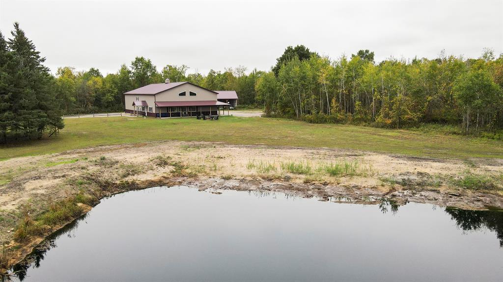 Legacy Hunting & Investment Estate with Lodge on 773.42?? Acres in Central Michigan

This exceptional 773.42?? acre property stands as one of Michigan's legacy estates for hunting, recreation, and investment. Located in Arenac County just 3 miles from Au Gres, This property offers the rare combination of total privacy and proximity to high-class Lake Huron recreation. Owners can enjoy the peace and quiet of their own private land while being close enough to explore boating, fishing, and the many offerings of Michigan's Great Lakes region. Spanning across a diverse landscape, the property features a balanced mix of hardwoods including oaks and maples, thick lowland bedding areas, and open ground with several established food plots. A well-designed trail system and multiple elevated blinds provide seamless access to every corner of the land, creating an environment well-suited for whitetail, turkey, and other game. Generations of management have gone into this property, with a proven history of producing success year after year. 

At the heart of the estate is a 3,600?? square foot barndominium lodge, purpose-built to accommodate large groups. The lodge offers 10 bedrooms, 2 full baths, and a spacious open dining and living area designed for gathering. An attached garage and shop space with dual 16' overhead doors provides functionality for equipment, gear, and vehicles. Beyond hunting and recreation, the lodge has proven rental and investment potential, with a track record of generating income through vacation rentals and gatherings. 

The property is currently enrolled in the Qualified Forest Program (QFP), providing valuable tax benefits while also supporting sustainable forest management and habitat improvement. Two ponds further add to the year-round recreational appeal, offering opportunities for fishing, swimming, or simple relaxation by the water. Whether for private use, corporate retreats, or as an investment-grade holding, this estate represents a rare opportunity to own a large, well-managed property wi