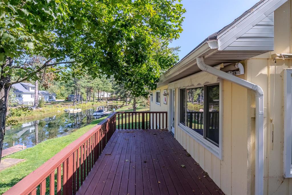 Walk out on the channel of highly sought after Otsego Lake in Gaylord! This inviting four bedroom ranch style home welcomes you with an open main floor designed for both comfort and connection. Updated kitchen finishes, vaulted ceilings, and expansive windows create a bright and airy space that frames peaceful views of the backyard and water. The main level features two bedrooms, including a serene primary suite with a private ensuite that feels like a retreat. The finished lower level adds two more bedrooms, a full bathroom, and convenient laundry, offering plenty of room for guests or extended living. Step outside to a wrap around deck and a cozy firepit that set the stage for unforgettable gatherings. This is a rare chance to experience lake living at its best and you will not want to miss it!