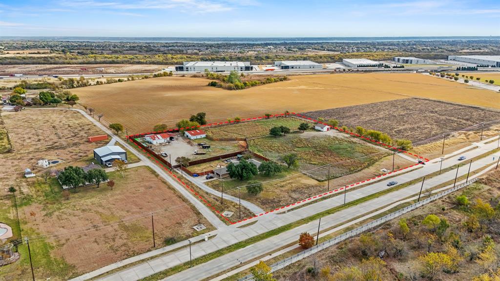 Discover an exceptional opportunity to own 4.65 acres of premium land in one of Rowlett’s most desirable and fastest-growing development corridors. Strategically positioned just off Merritt Road and the President George Bush Turnpike, this property sits within the coveted Northshore Mixed-Use District, offering outstanding potential for future commercial, residential, or mixed-use development. Fully equipped with all major utilities—including water, electricity, sewer, and storm drainage—this site provides a rare combination of immediate functionality and long-term development flexibility.Currently income-producing, the property includes a 4-bedroom, 2-bath residence of 2,145 sq ft of living space, along with additional revenue streams from storage units and land leases. This makes it an ideal buy-and-hold investment with solid cash flow while planning future development.Whether you’re a developer, investor, or visionary buyer, this property offers unmatched potential in a high-growth area surrounded by new infrastructure, expanding industrial and retail projects, and master-planned residential communities.