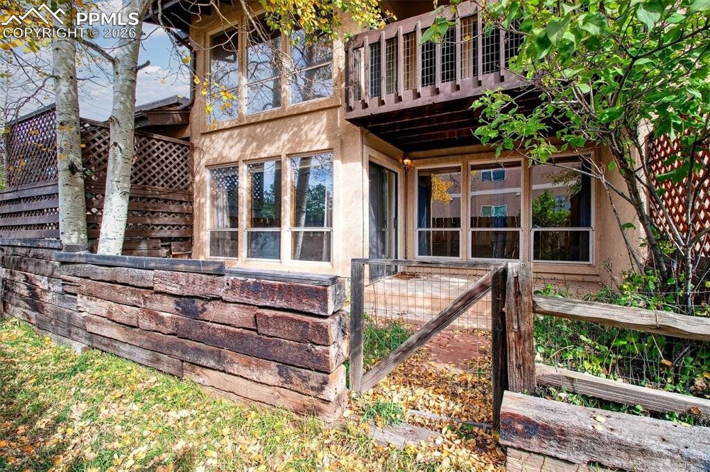 **NEW BOILER SYSTEM**NEW CARPET LOWER LEVEL**NEW BATHROOM IN LOWER LEVEL**Amazing town home! Large open floor plan, with log style wood trim railings and decor. Large windows for lots of natural light. Kitchen has hickory cabinets and wood floors & tile tops. Also has 2 zone radiant hot water heat, Primary bedroom on lower level has mini wet bar and walkout to garden level. Lots of storage, covered deck off of dining area and primary bedroom. Also includes carport for parking. Laundry closet is located across from front door and is setup for stack-able washer/dryer. This property has lots of hiking and biking trails, and close to nearby golf coarse. A unique town home with maintenance free living.