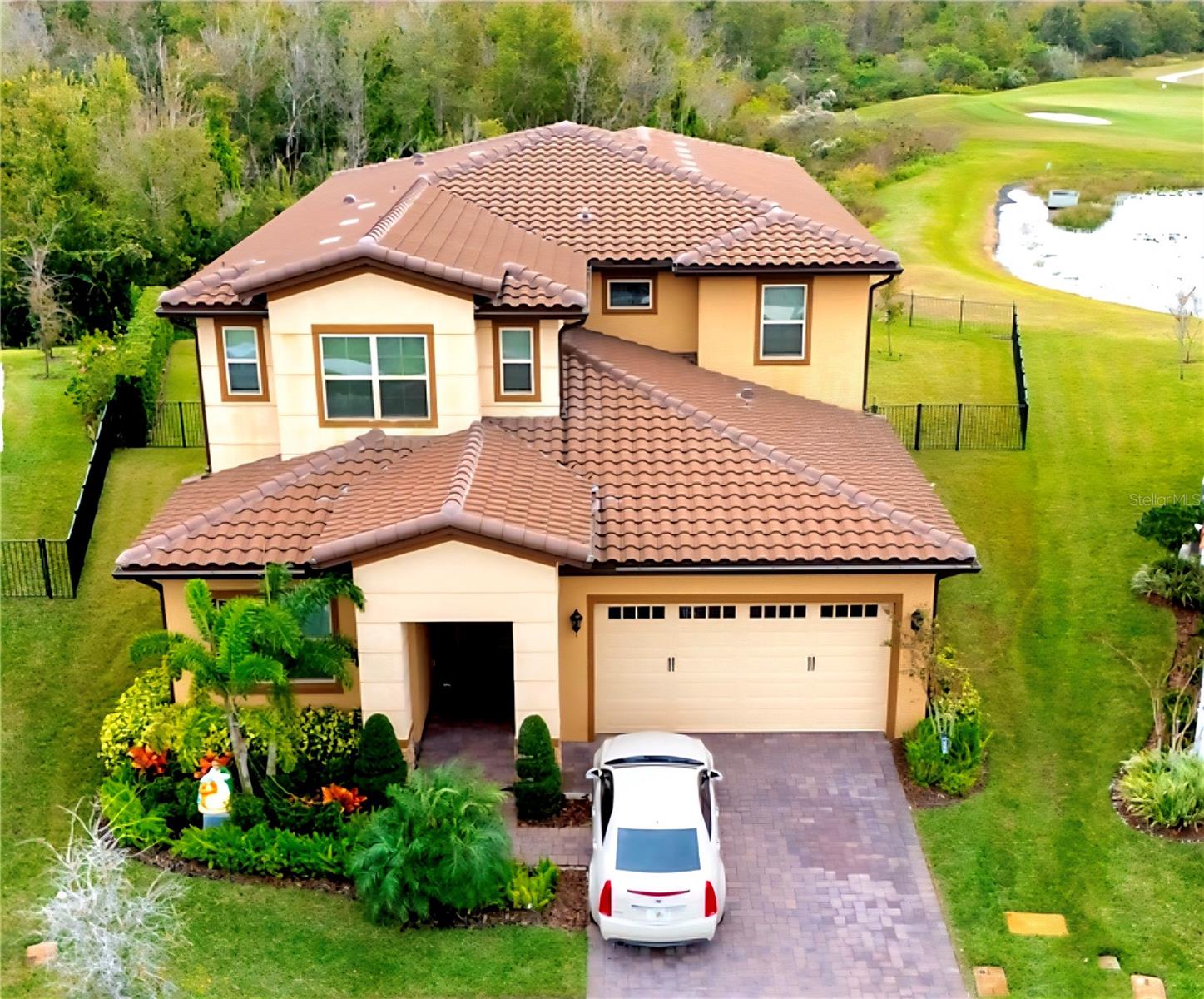 Excellent opportunity to own this stunning property located in the highly desirable Eagle Creek, a 24-hour gated golf community offering resort-style living, in the prestigious Lake Nona area. Welcome to your secluded nature lover/ golf lover retreat, where you will be impressed by this magnificent premium lot offering breathtaking water views, a conservation area, and golf frontage adjacent to the 14th hole of the impeccable, championship-level golf course. This creates a dreamlike landscape of peaceful vistas that provide a daily dose of tranquility. Located within the exclusive, 24/7 gated community of Eagle Creek in Lake Nona, this approximately 4,000-square-foot residence revolves around spectacular views from different areas in the house. The outdoor spaces include an unusually extra-large, private backyard with endless possibilities. A nature lover’s dream to enjoy the frequent visits of cardinals and other bird species, as well as occasional sightings of deer families.  Additionally, the serene afternoons offer a magnificent display of the golden hour during the Florida sunsets. The sparkling pool (with water heater), invite you to enjoy the water on sunny days and all year round, while the summer kitchen and covered lanai make it easy to entertain with complete ease, whether cooking and serving by the pool, watching the golfers at play or enjoying a casual Florida-style evening. Even your pets have their own safe space thanks to a private and fenced yard to play and exercise. For moments of quiet and private contemplation, the expansive wrap-around second-level balcony (accessible from two bedrooms) offer panoramic views of the landscape and golf course, capturing breathtaking sunrises and sunsets. The interior is bathed in natural light, highlighting the open floor plan ideal for both elegant gatherings and intimate family moments. From the front entrance, wide sliding doors and windows frame the exterior backyard landscape, creating a seamless connection between the interior and nature. The home has room for everyone: 4 bedrooms each with their ensuite bathroom, a guest bathroom, living room, dining room (overlooking the backyard views), a drop zone by the garage entrance, a second-floor loft / multi-purpose space, and a two-car garage with tandem. The master suite includes a walk-in closet with direct access to the large functional laundry room (with utility sink and ample counter and storage space). The master bathroom offers a spa-like experience with its spacious shower, double vanity, private toilet area, and a deep soaking tub perfect for unwinding after a busy day. The gourmet kitchen is any chef’s dream, equipped with stainless steel farmhouse sink, extraordinary granite counter and storage space.  The modern amenities are centered around a functional double island, ideal for buffet style setup of dishes, family cooking, casual meals, conversation, and gatherings while cooking. Other highlights include retractable blinds on all three sliding doors in the house, and a fully fenced yard with privacy hedge.Ideally located near Lake Nona’s area, premier dining, shopping, and major highways. Near to MCO Airport and the new USTA training center, and just a short drive to top theme parks and beaches; you'll enjoy quick access to everything Central Florida has to offer. Top-rated schools, world-class amenities, and a home that has it ALL – NO CDD - PRICED TO SELL – schedule your private tour today!