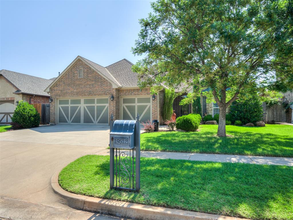 Just WOW....this beautiful move-in ready, split floorplan of 4 bedrooms, 2.1 bathrooms and 3 car garage home in the desirable ELMS at STONEBRIAR is ready for its next owner!  And the HOA maintains both the front and backyard-mowing, weed eating, fertilizing (excludes flowerbeds). Upon entering, a gas log fireplace with a curved stone hearth, wood mantle and stone cascading up to the ceiling immediately draws you into the home! The plantation shutters in the living room overlooking the back provides another classic, timeless luxury this home offers! The built-in buffet with glass front hutch in the dining room anchors the dining room providing elegance and storage! The kitchen features a gas stove/oven, microwave drawer and dishwasher. One side of the home has the primary bedroom and bedroom #2 with bedroom #3 and #4 located on the other side of the home.  Although a true 4 bedroom home, if an office or 2nd living space is preferred, bedroom #2 is situated perfectly for that option featuring wood flooring, large closet, bay widow and plantation shutters! The primary bedroom suite is a true dream with an oversized bathroom space featuring double vanities/sinks, soaking tub and tiled shower! Knotty Alder cabinets throughout with many built-ins are great for displaying your favorite things and functional, providing beautiful storage solutions making organization a breeze! The combination of wood floors, tile and carpet provides the right mix for both functionality and comfort. The laundry room features a folding space counter, storage and is not a walk-through to the garage.   Enjoy the backyard with the extended covered patio and landscaping!  This well maintained home in desirable gated community with EDMOMD SCHOOLS and OKC UTILITIES is ready!  And with the HOA maintaining the lawn, it allows more time to enjoy the neighborhood amenities of the pools, walking trails, pond and children’s play area.  Seller prefers to sell in As-Is Condition, CASH, CONV, FHA, VA.