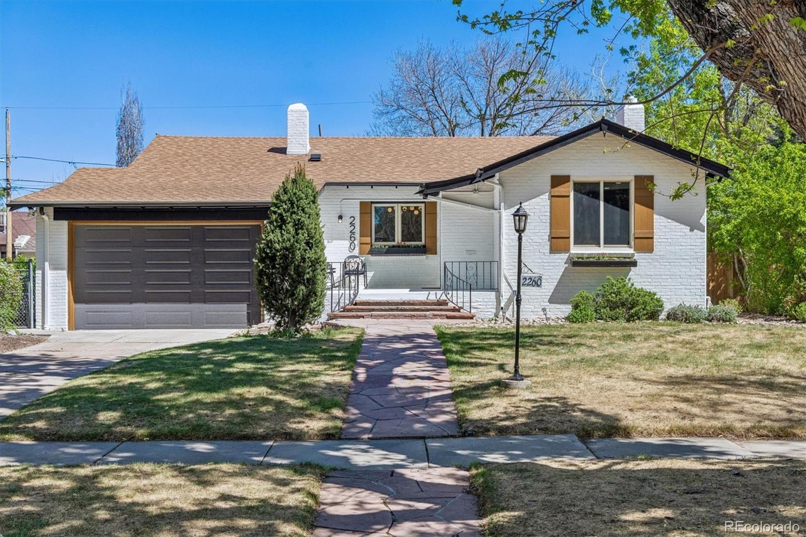 Welcome to 2260 Leyden St located in the highly desirable Park Hill neighborhood. This beautifully renovated home offers a sophisticated blend of original charm and modern luxury. This property has been fully reimagined and offers 5 spacious bedrooms and 3 bathrooms, stunning refinished original hardwood floors, updated decorative lighting and fresh interior paint throughout. This home delivers curated spaces perfect for entertaining as the floorplan flows effortlessly from the living room into the kitchen and dedicated dining space. The impressive fully remodeled kitchen is complete with stylish black and gold appliances and is the perfect place to test out the new recipe you've been wanting to try! Brand new designer cabinetry, timeless quartzite countertops, a large island for casual dining & gathering, new range hood and an additional wine bar complete this well-appointed space. On the main floor you'll find a dedicated office, a massive primary suite with direct access to the private backyard and a stunning en-suite bathroom complete with a freestanding tub, walk in shower, designer tile & gleaming gold fixtures. Two additional bedrooms share another fully updated bathroom off the front hall with custom tile, new plumbing and lighting. In the basement you'll find 2 additional bedrooms, another remodeled bathroom, and a cozy family room, as well as a large laundry room with ample storage. Outside you'll discover a new patio perfect for dining alfresco and grilling. The tranquil backyard is a true oasis thoughtfully designed by a landscape architect featuring a water feature, perennials that come back year after year and a side yard with turf to play games and space for your furry friends. This home offers a 2-car garage, an additional off-street parking space, and abundant storage in the basement. Close to shopping & dining as well as other delightful attractions - the Denver Zoo, City Park and Museum just 10 minutes away! Stop the search - you've found the one!