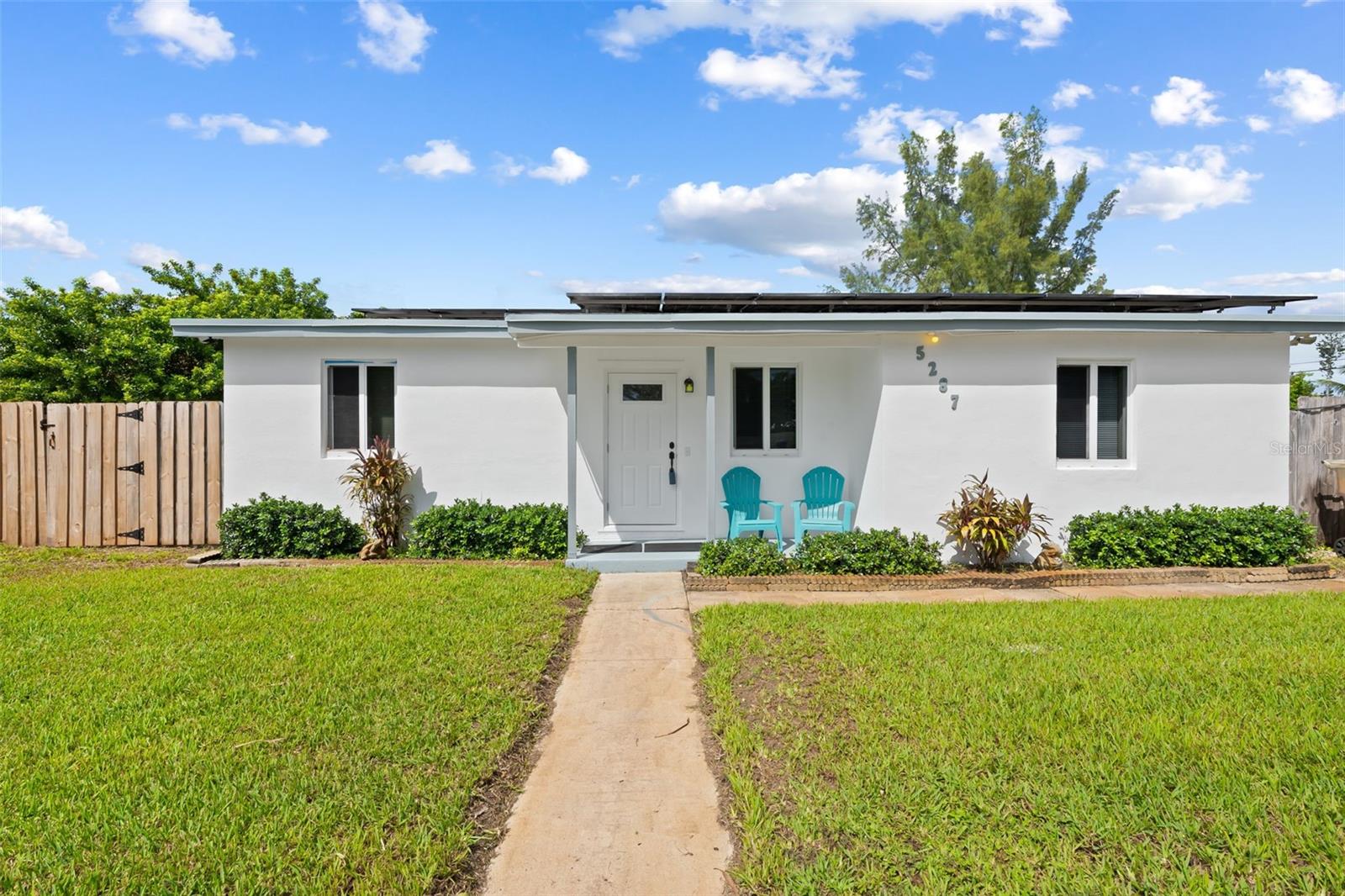 Discover the perfect blend of thoughtful updates, everyday comfort, and outdoor space that is hard to find. Situated on a quiet street, this well-maintained block home offers a desirable split-bedroom floor plan with 3 bedrooms, 2 bathrooms, with wood-look ceramic tile flooring throughout. The updated kitchen, featuring soft-close cabinetry, recently renovated in 2018, provides a welcoming space for everyday living. Additional interior features include indoor laundry and an electric fireplace that conveys.Peace of mind comes from numerous important improvements, including impact windows, a 2020 A/C system, a 2018 tankless water heater, 2015 full roof replacement, and 2026 impact-rated front and rear doors. The exterior and doors were also freshly painted in 2026, while the rear pavers and driveway were sealed the same year. The home is wired for security cameras at all four corners, and a well supplies the irrigation system providing a savings year-round.The highlight of this property is the impressive 0.35-acre lot—a rare opportunity to enjoy this much outdoor space. The beautifully manicured backyard offers room to entertain, play, garden, or simply enjoy the privacy and flexibility that this larger property provides. A permitted 10' x 20' storage shed adds valuable enclosed space for tools, equipment, and outdoor essentials. Solar panels, designed to accommodate a larger family's energy needs, are to be PAID OFF AT CLOSING. With substantial improvements already in place and a backyard that truly sets it apart, this property offers a unique opportunity to enjoy comfortable Florida living with room to spread out.