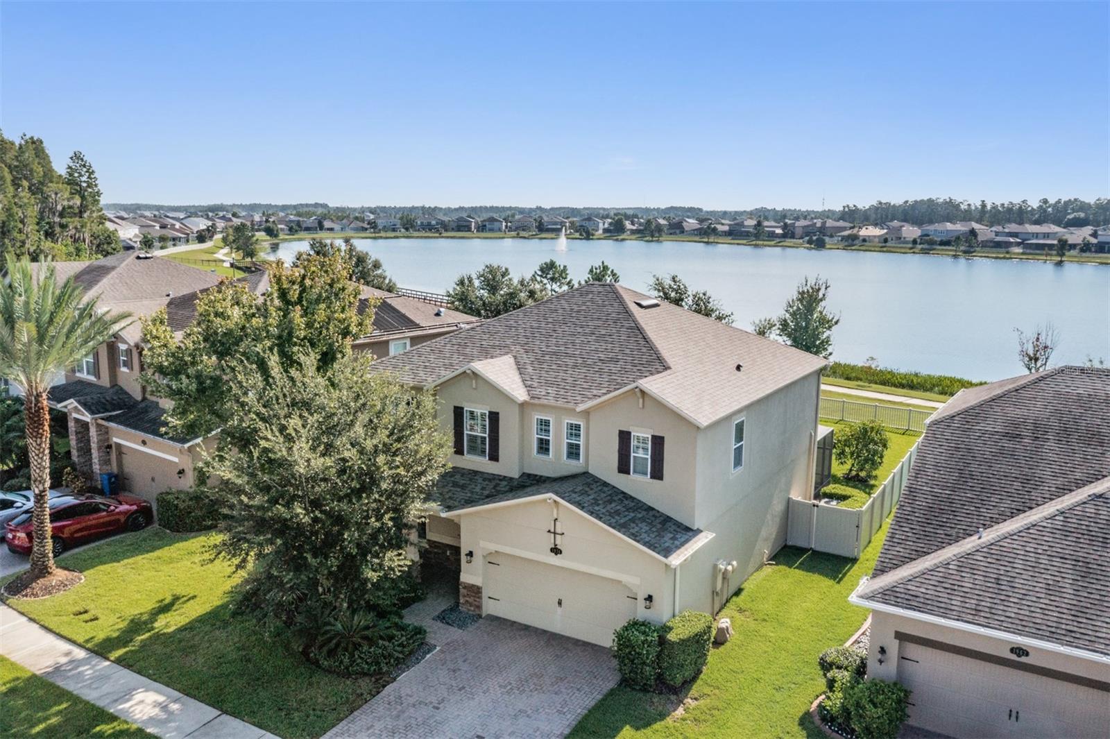Welcome to this stunning 4-bedroom, 3.5-bathroom home perfectly situated on a beautiful lakefront lot in Long Lake Ranch.  From the moment you arrive, you’ll be impressed with the lush landscaping, brick-pavered driveway, and timeless curb appeal.

Step inside to discover an open-concept floor plan filled with natural light, highlighted by triple sliding glass doors and elegant plantation shutters throughout. The formal dining room offers the perfect space for entertaining, while the chef’s kitchen boasts a large center island, double ovens, abundant cabinetry, and extra storage tucked under the stairs. Gorgeous wrought-iron stair railings and upgraded laminate and tile flooring (no carpet!) add style and durability to every room.

The expansive bonus room offers endless possibilities—game room, media room, or home office. Retreat to the huge master suite featuring tray ceilings and a spa-like ensuite. Outdoors, enjoy serene lake views from your large screened-in patio or unwind under the charming pergola in your fenced backyard.

This community is packed with resort-style amenities, including a clubhouse, pool, splash pad, playgrounds, dog park, tennis and basketball courts, fishing dock, and even a kayak launch!

With a brand NEW ROOF and countless upgrades, this home is move-in ready and truly has it all.