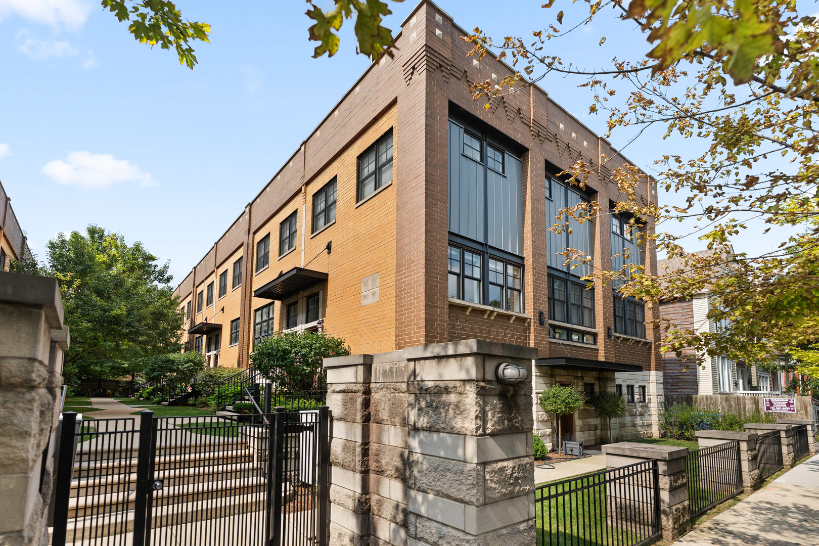 Experience this outstanding 4-bedroom, 3-bathroom townhome nestled in the heart of the dynamic Logan Square community. Set within a secure gated courtyard, this home offers the practicality of a 2-car attached garage while providing the spaciousness of a single-family residence. The airy atmosphere is enhanced by 10-foot ceilings and elegant hardwood floors throughout. The seamless flow of the living and dining areas extends to a private balcony, ideal for relaxation or grilling. The chef's kitchen has been tastefully updated. The second floor has three bedrooms and two full baths, including a luxurious primary suite with a generous walk-in closet and an en-suite bathroom featuring a dual vanity, shower, and separate soaking tub. On the top floor, you'll find a versatile space complete with a wet bar, perfect for an office or exercise area, and it leads to a private roof deck offering impressive skyline views. The lower level accommodates a fourth bedroom and a third full bath, great for guests or a home office. The location provides easy access to the 606 trail, major expressways, public transportation, parks, as well as a wide selection of restaurants and shops. Experience the pinnacle of modern urban living in this exceptional home!